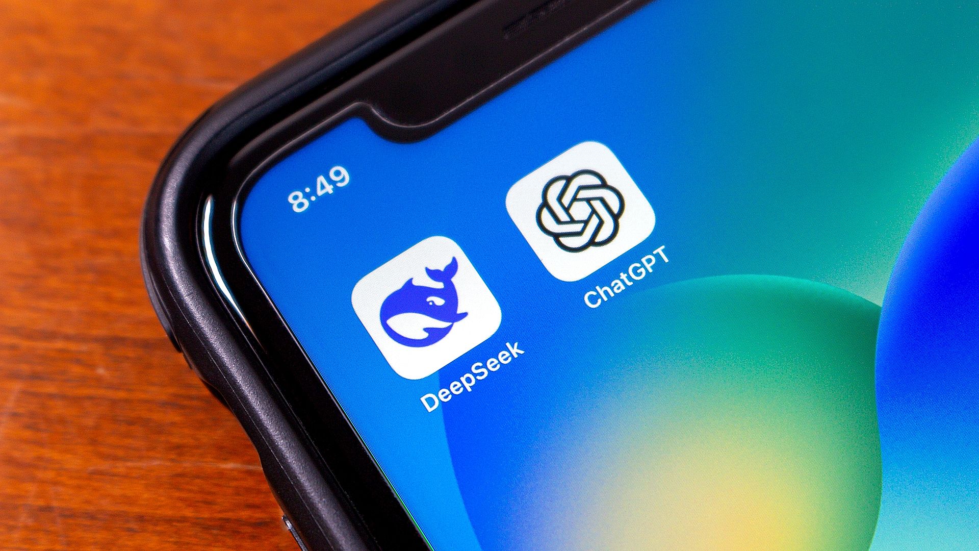 deepseek and chatgpt app logos on smartphone screen.