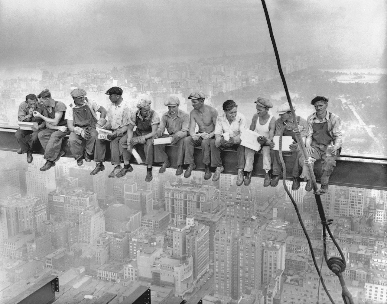 Iconic black and white photograph depicting workers sitting on a construction beam on a skyscraper