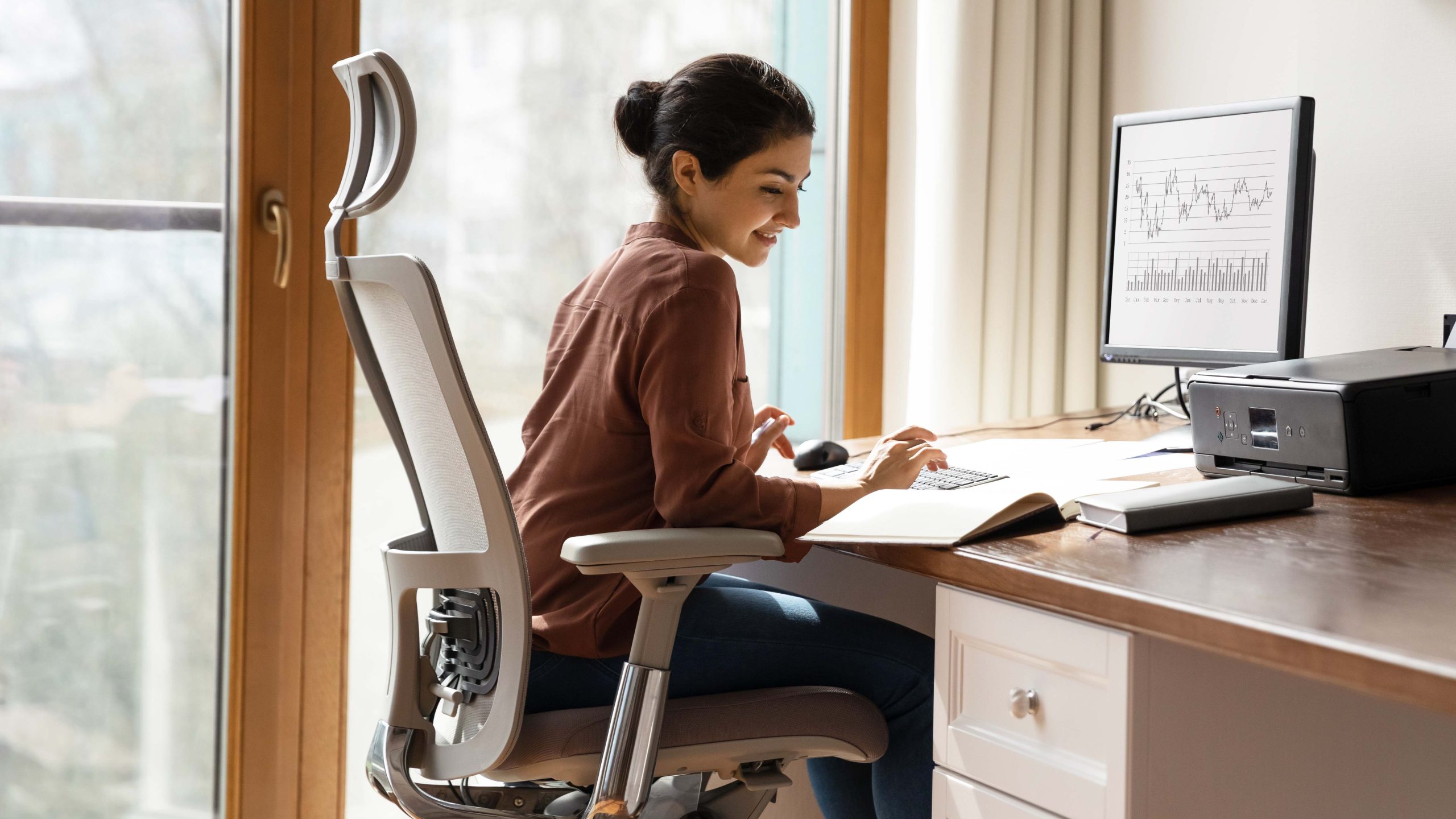 a photo of a woman sitting in an office chair