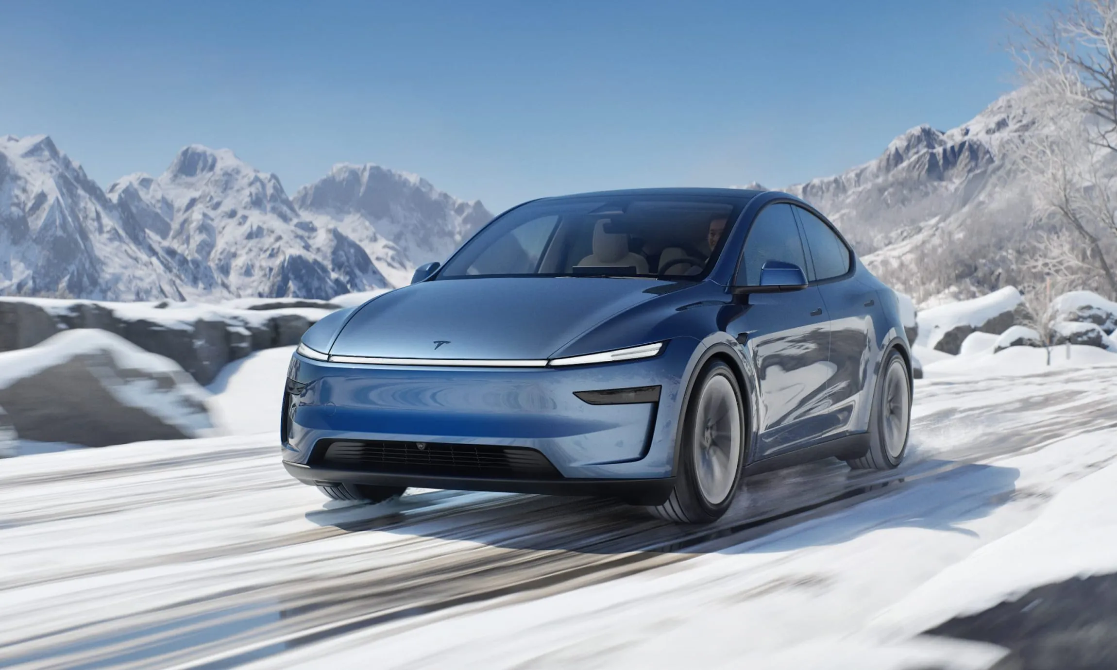 Blue Tesla Model Y Juniper in the snow