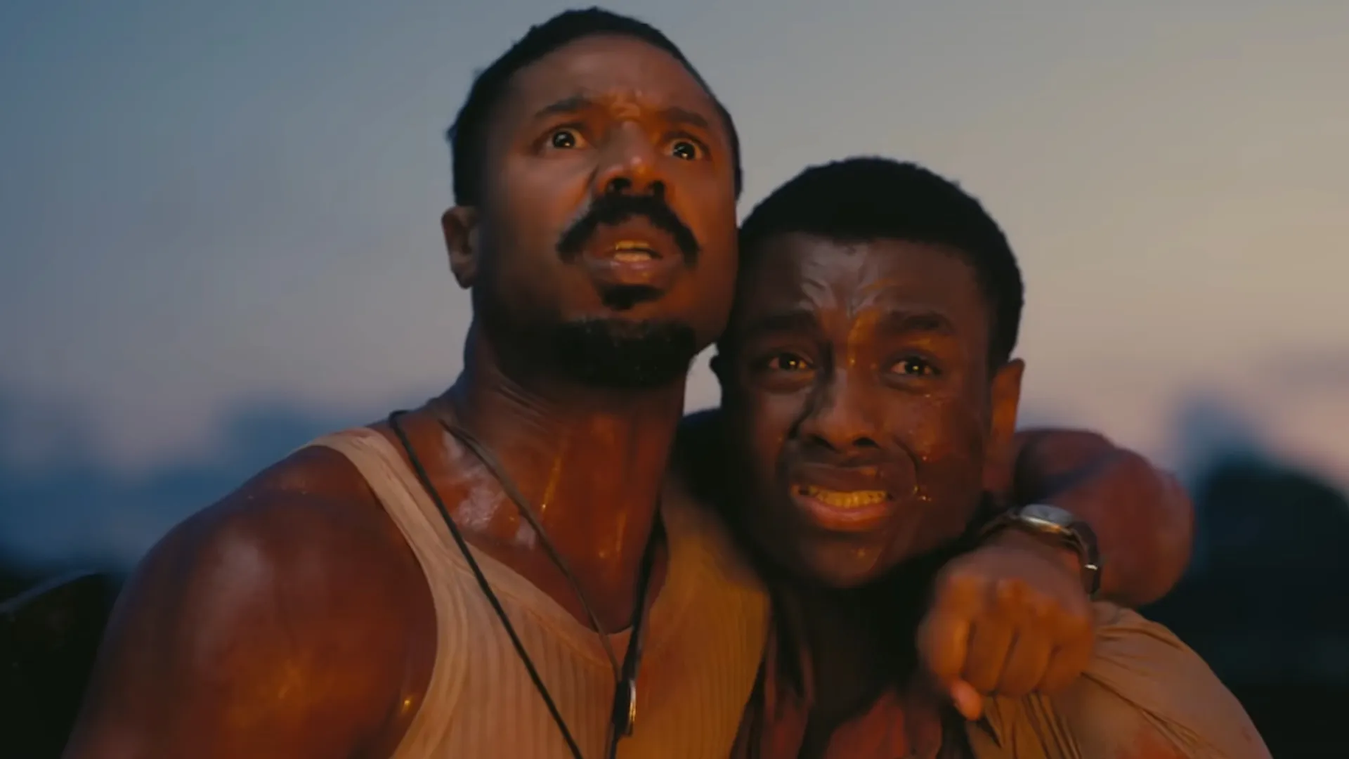 Michael B. Jordan holding Miles Caton in "Sinners."