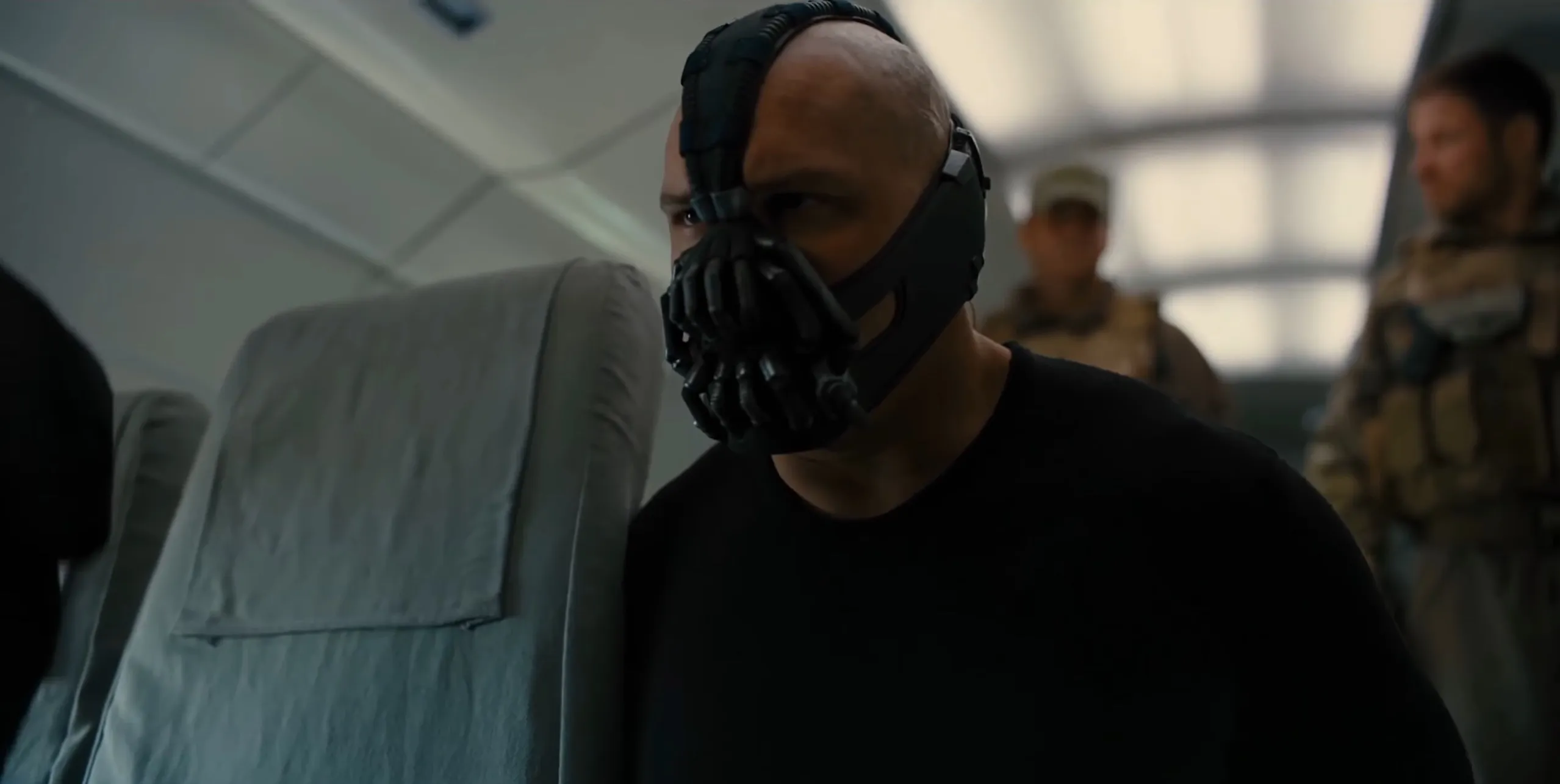 Bane on an airplane in "The Dark Knight Rises."