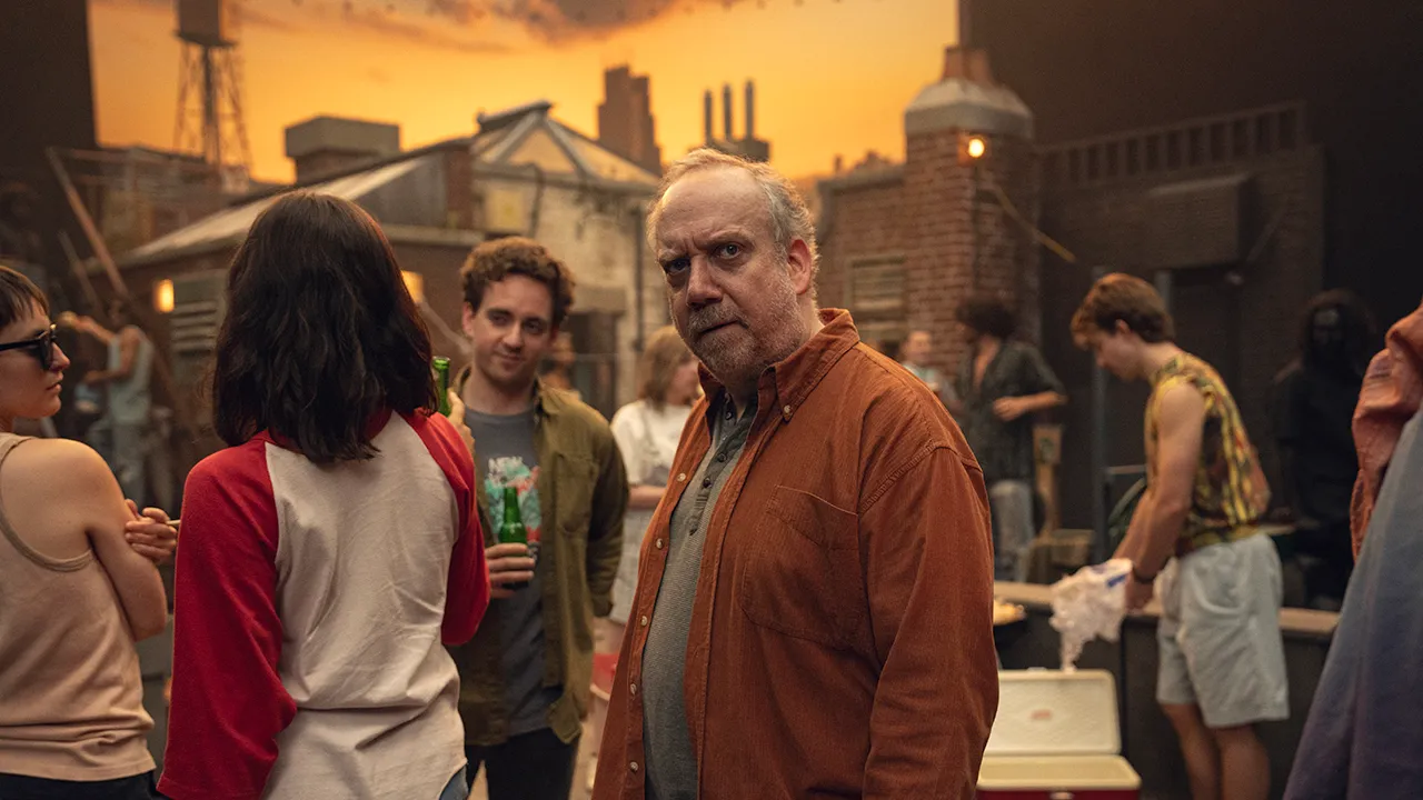 A man stands in the middle of an old photo in a scene from Black Mirror's episode Eulogy.