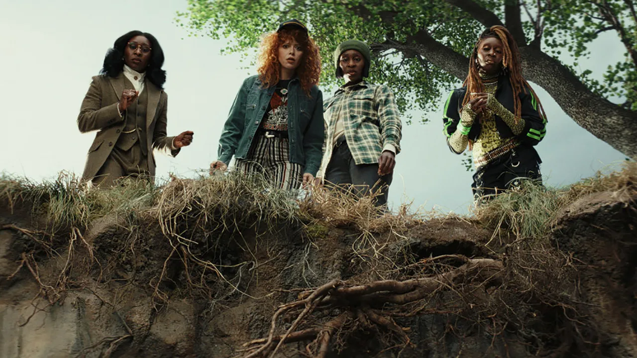 Four women stare into a big hole in the ground looking shocked in Poker Face on Peacock.