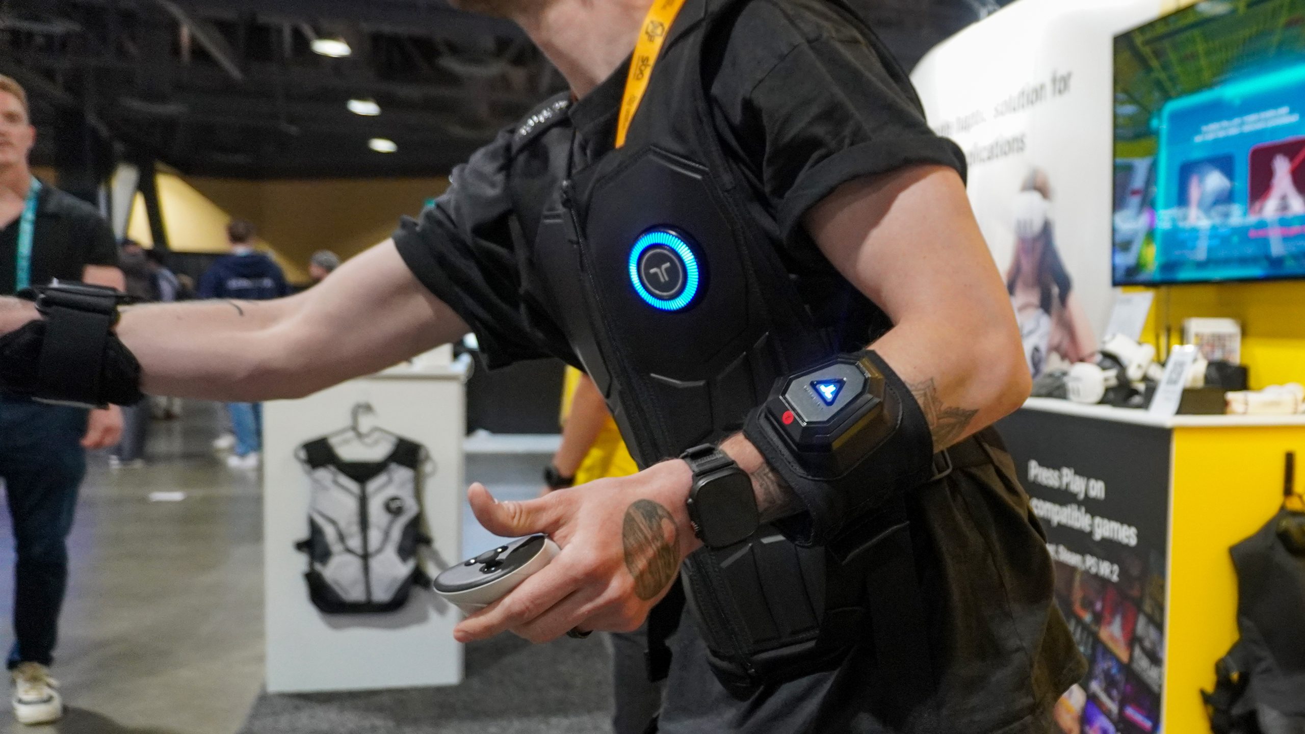 bHaptics Vr accessories: vest, gloves, sleeve with Meta headset at AWE 2025