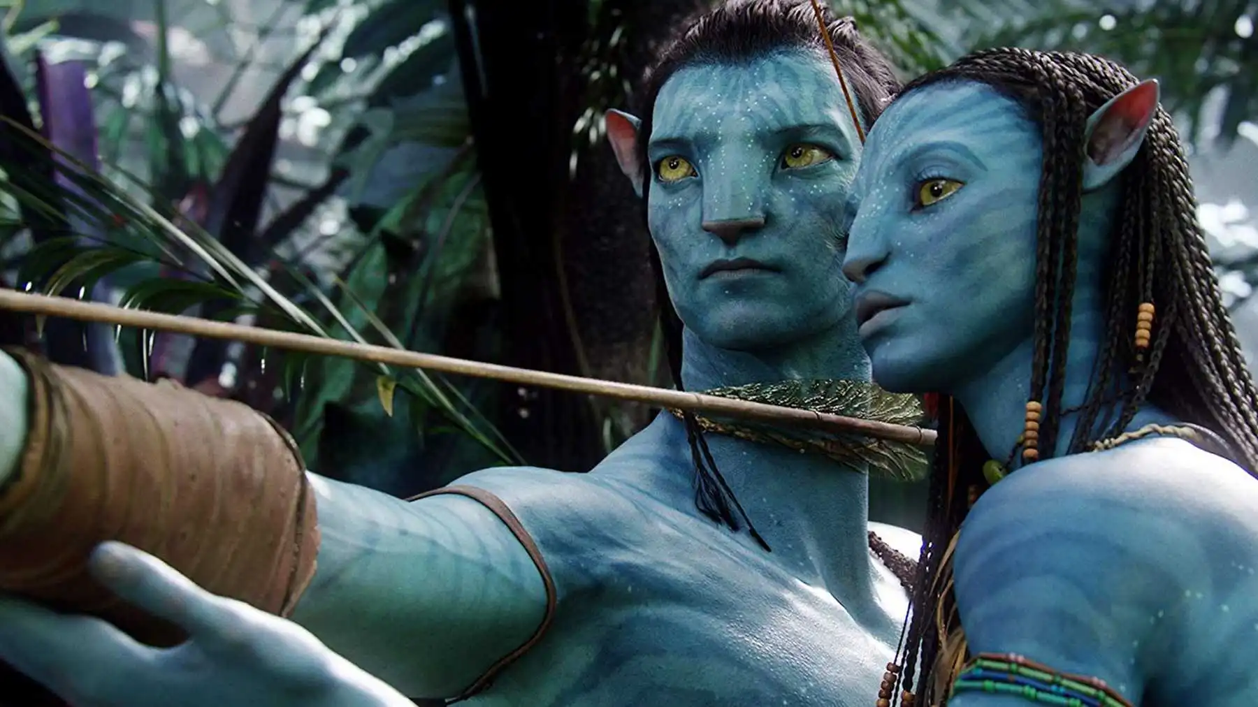 A male and female alien prepare to fire a bow & arrow in "Avatar."