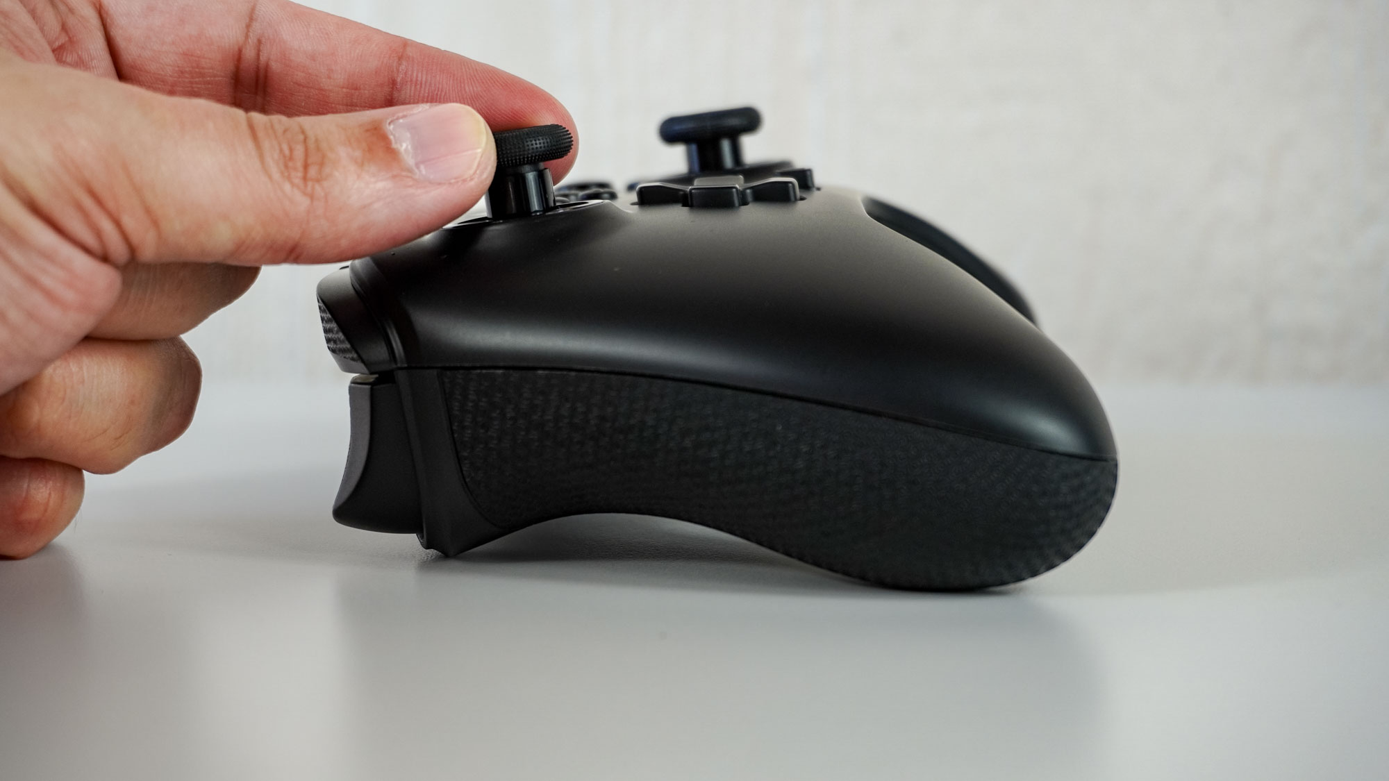 A person adjusting the thumbstick height on the PowerA Fusion Pro Wireless Controller