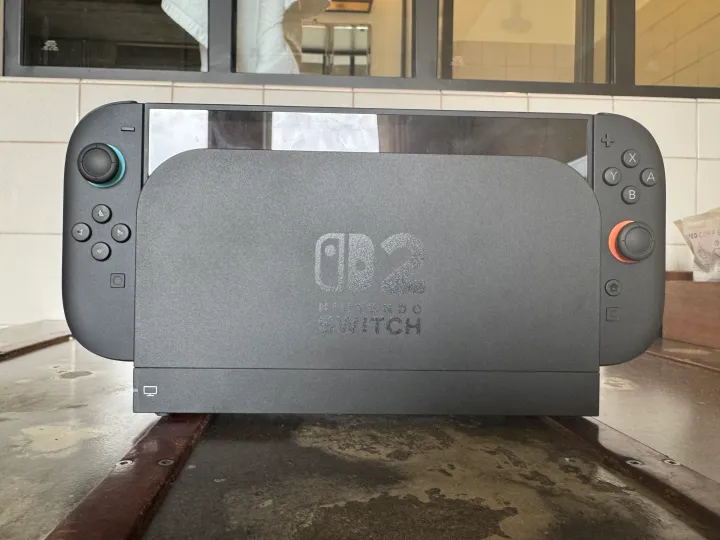 A Nintendo Switch 2 sits in a dock.