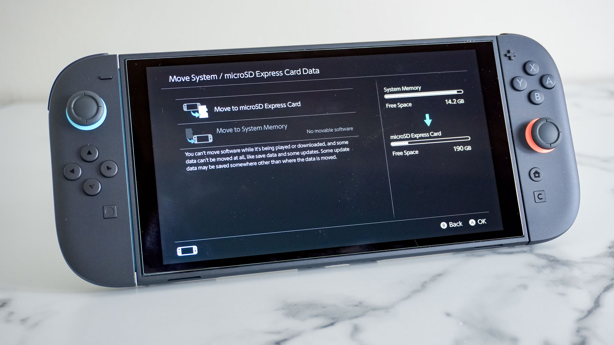 A Nintendo Switch 2 console on a desk showing off the console's Move System / microSD card Data menu screen