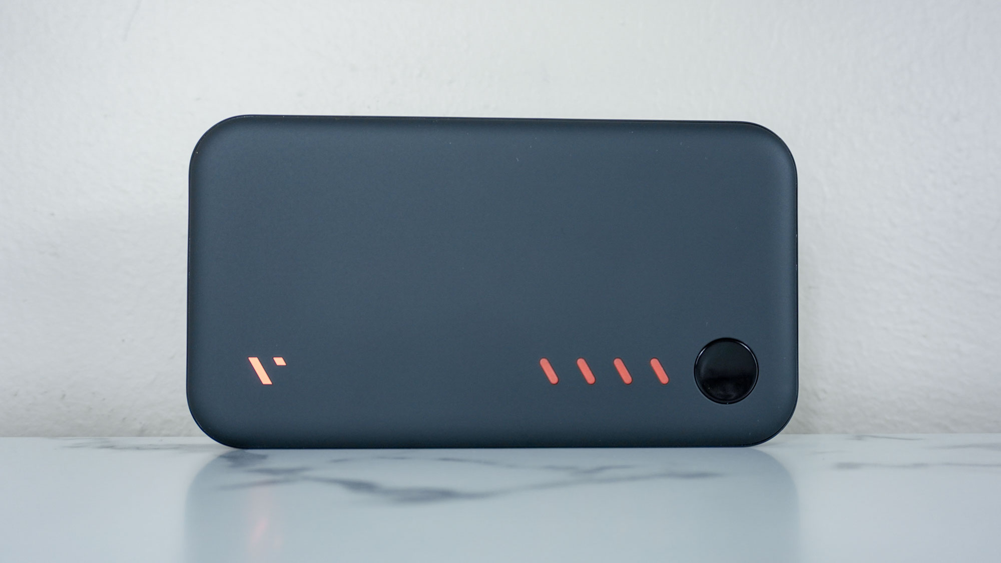 The Viture Pro Mobile Dock upright on a desk