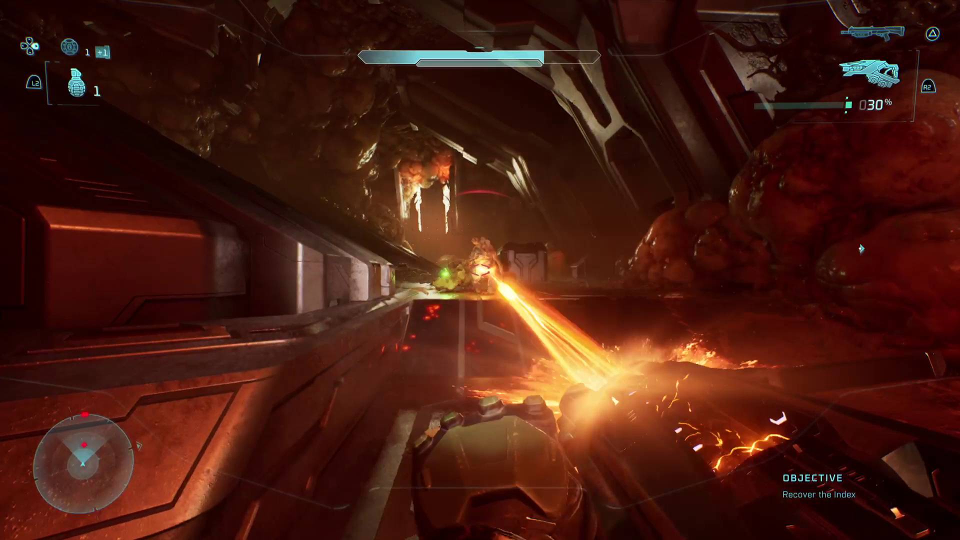 لاعب Halo: Campaign Evolved يطلق شعاعًا حارسًا على أعداء Flood القادمين في المكتبة