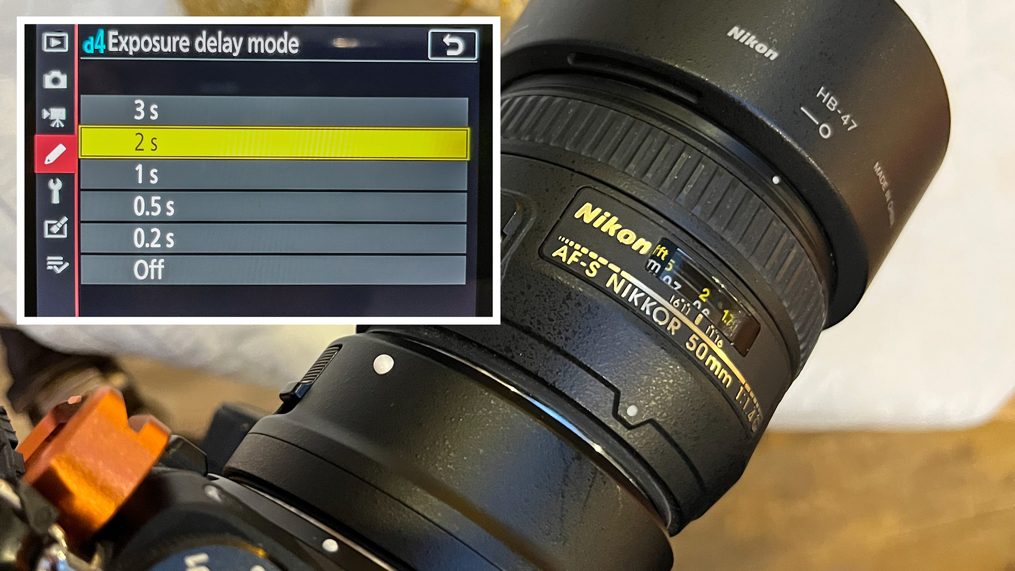 عدسة Nikon AF-S 50mm f/1.4G مع شاشة LCD خلفية مدمجة تعرض خيارات وضع Exposure delay mode