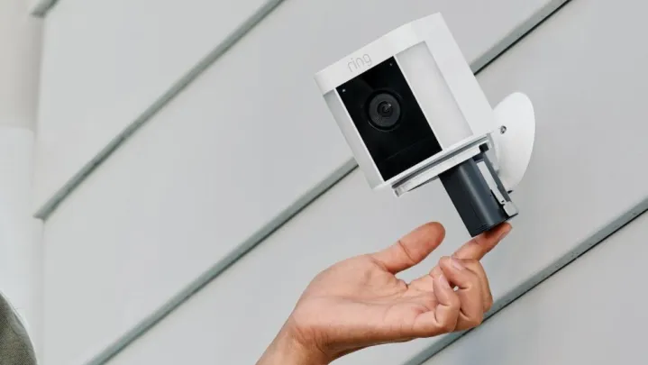 Spotlight Cam Plus battery being removed.