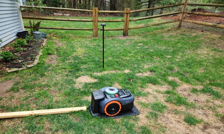 Segway Navimow i110 robot lawn mower, docking station, and antenna installed correctely to access satellite signals.