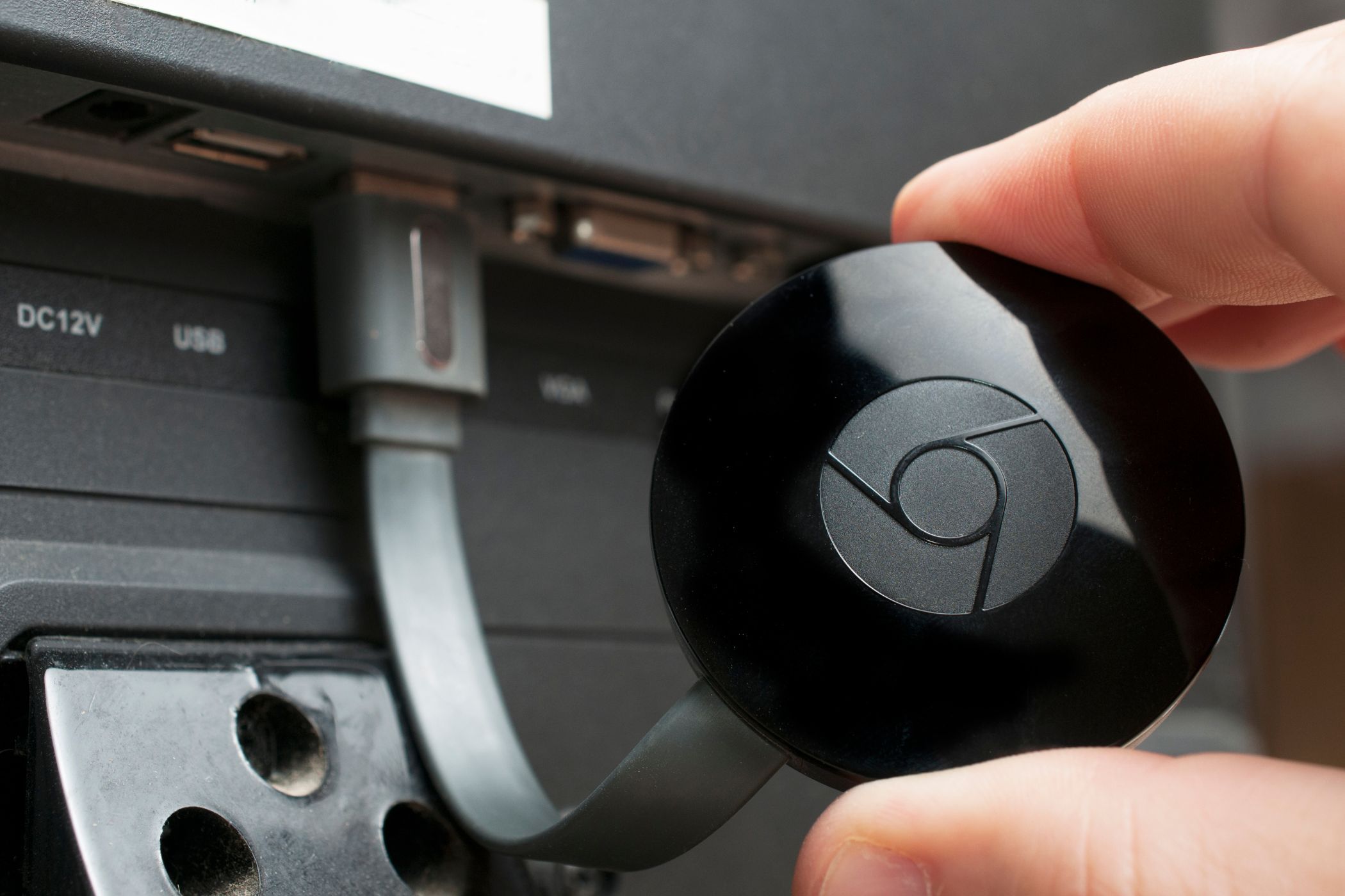 a chromecast device plugged into a tv
