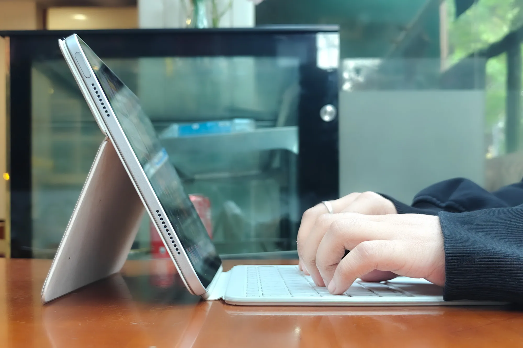 Person typing on the 11th Gen iPad.