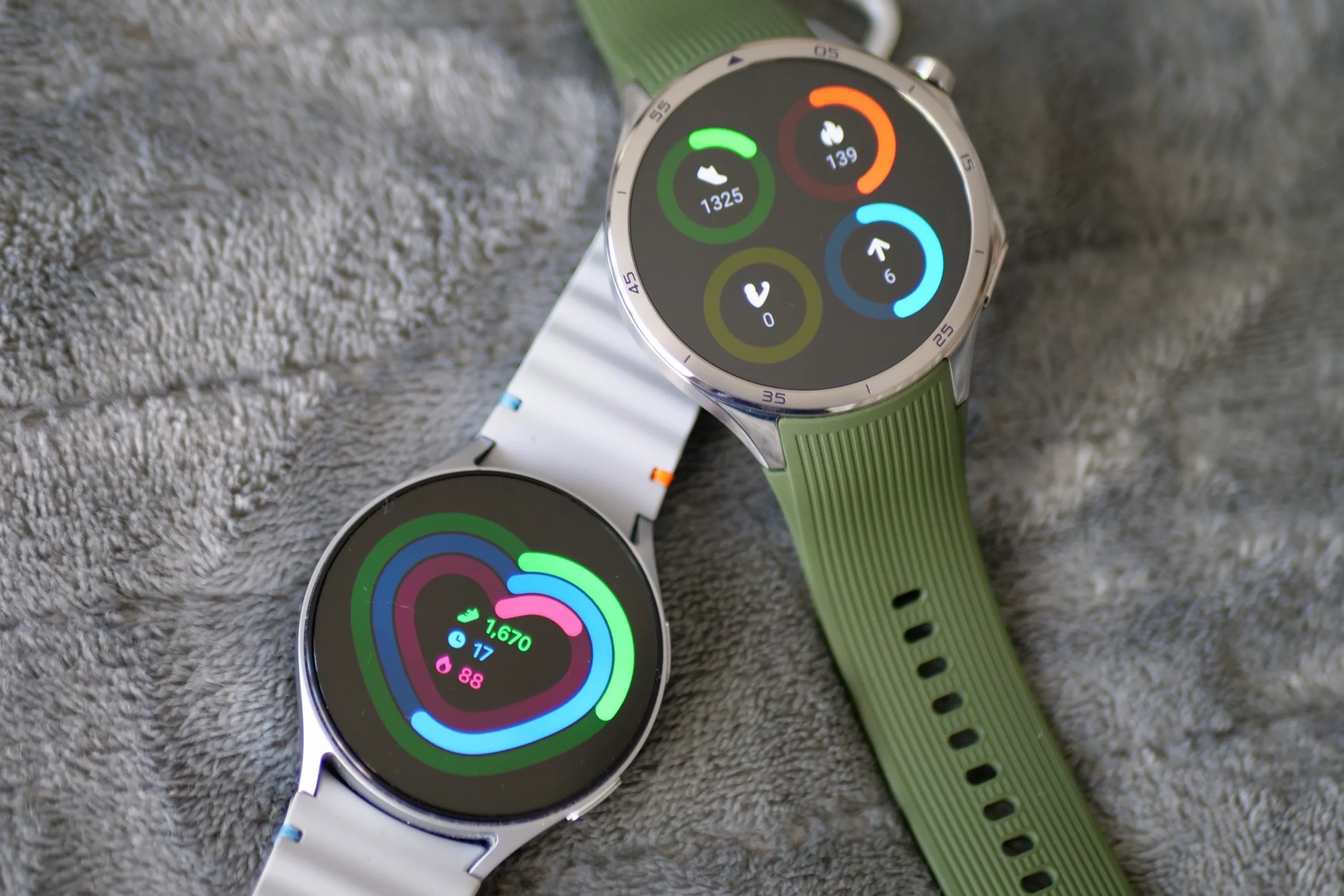 The OnePlus Watch 3 and Samsung Galaxy Watch 7 showing activity data.