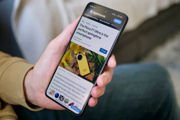 A person holding the Poco F7 Ultra using Chrome.