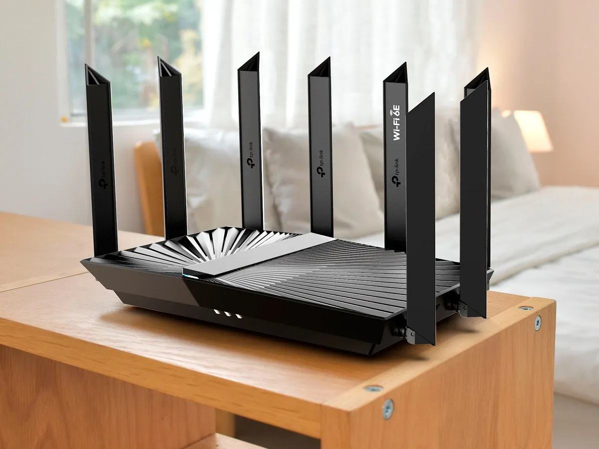 The TP-Link Archer AXE7800 tri-band Wi-Fi 6E router in a room.