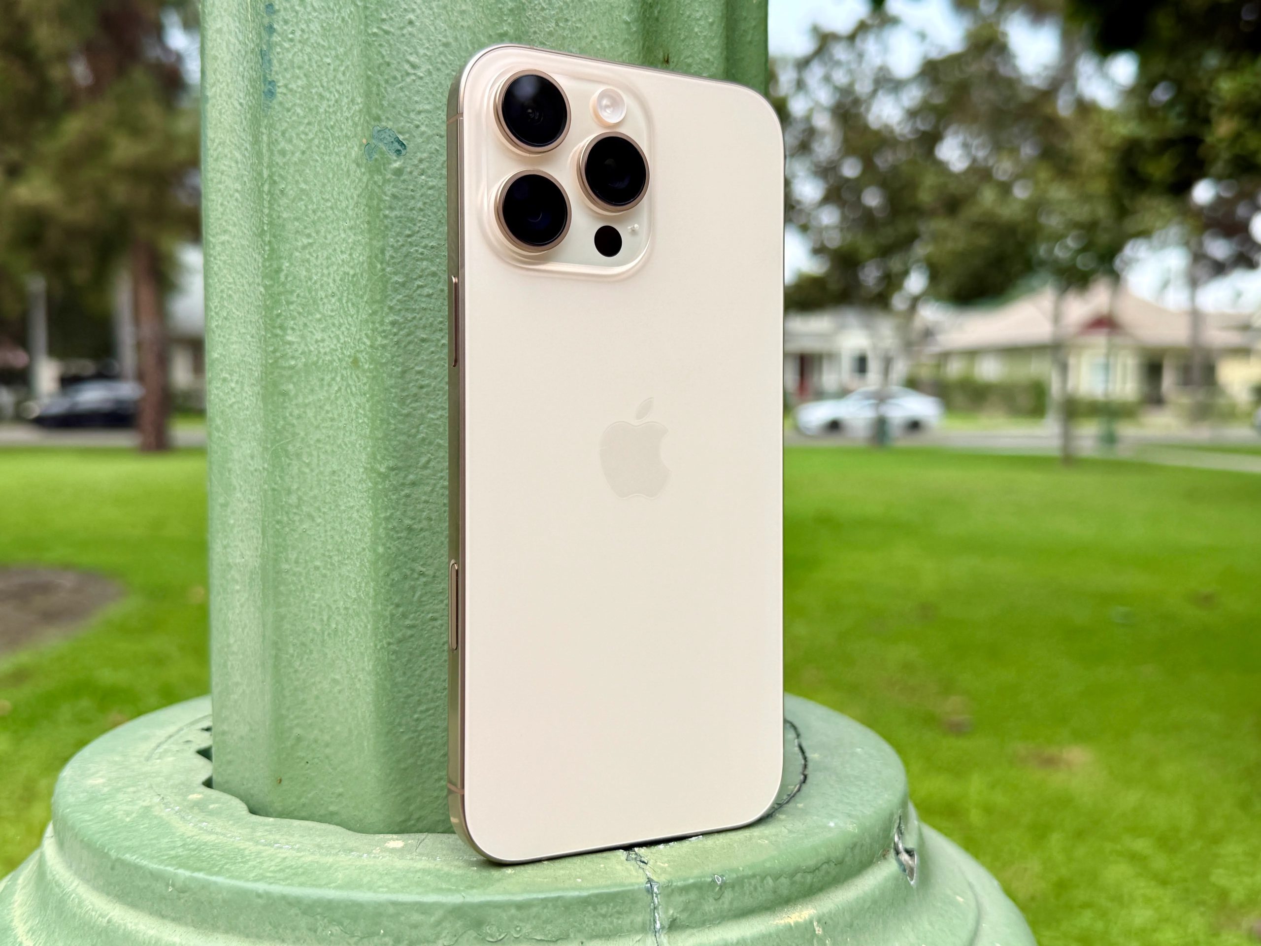 iPhone 16 Pro Max in Desert Titanium.