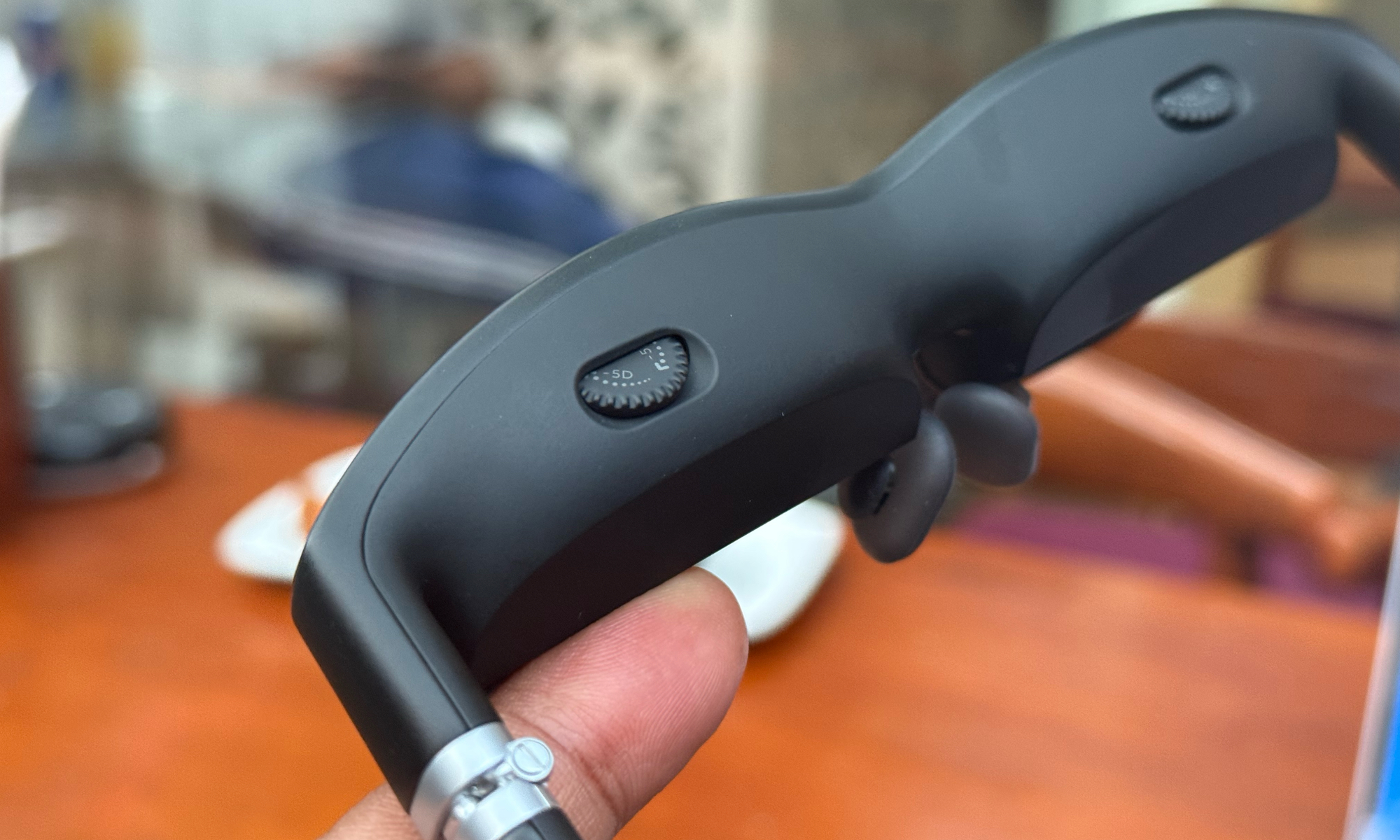 Vision adjustment wheel on the Viture One smart glasses.