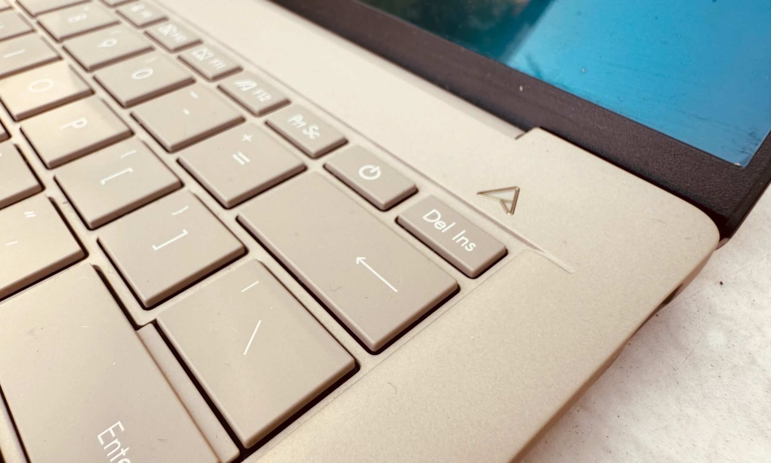 Closeup view of keys on Asus ZenBook A14 laptop.