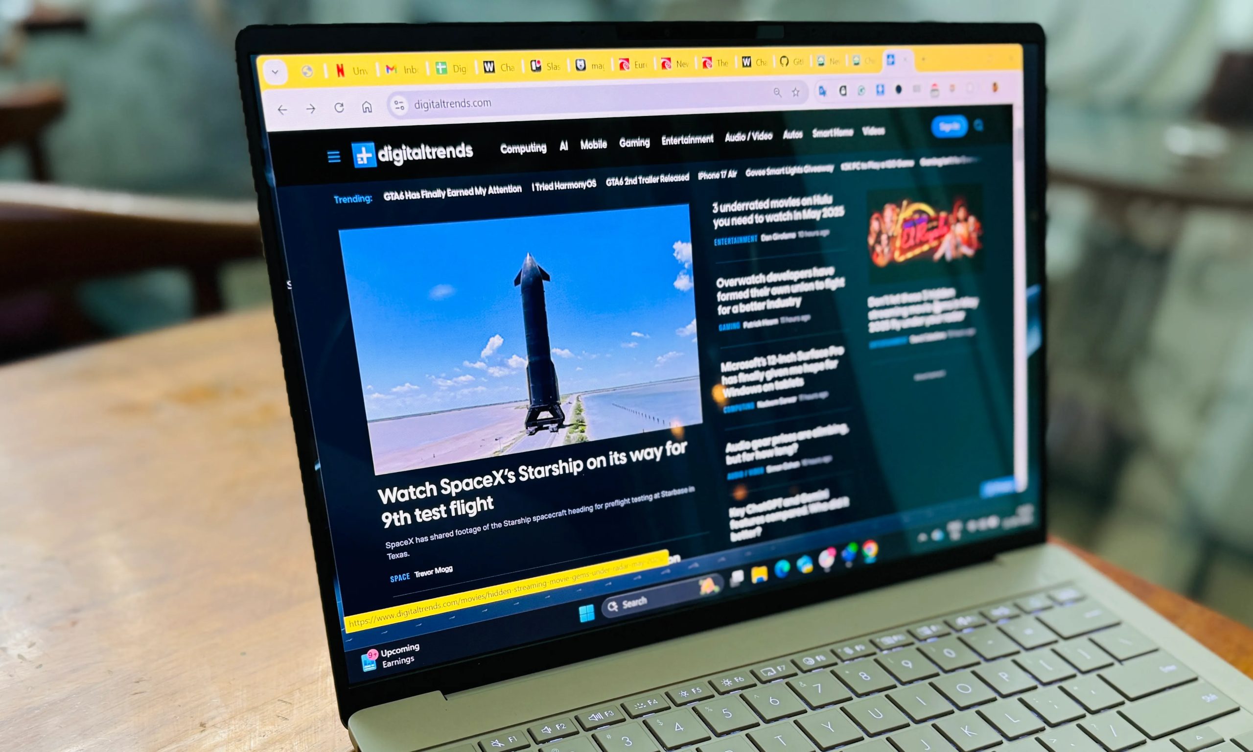 Browsing a website on Asus ZenBook A14 laptop.