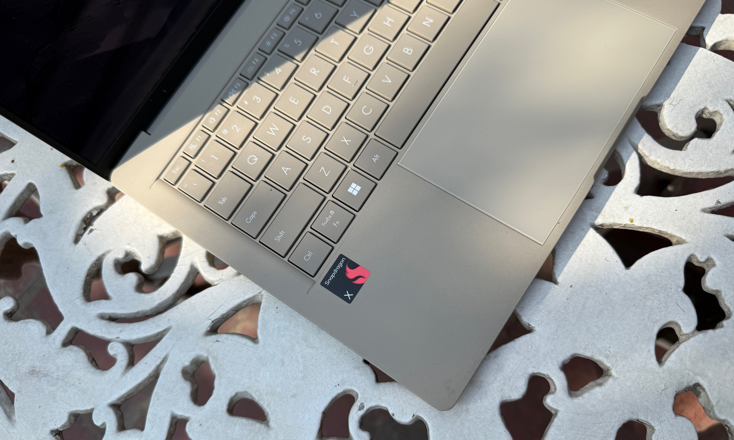 Snapdragon label on Asus ZenBook A14 laptop.