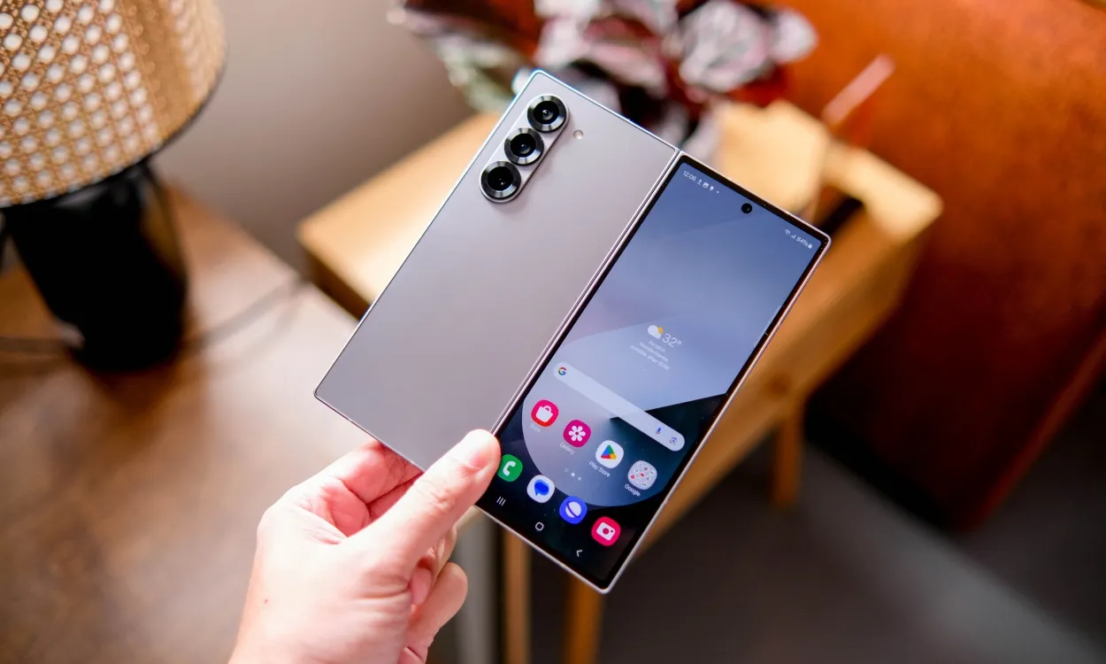 shot of a hand holding the Samsung Galaxy Z Fold 6 phone with its thin rear panel and front display