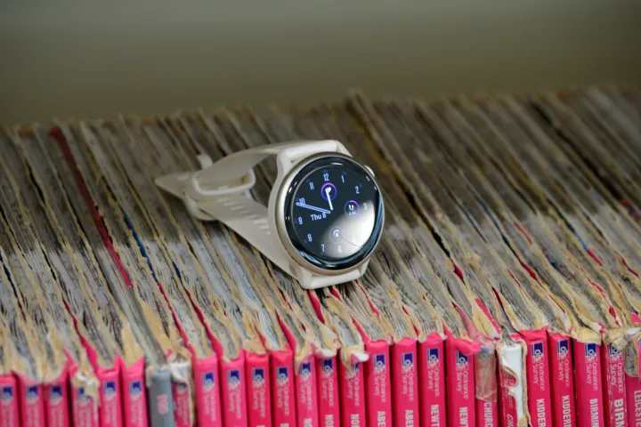 The Garmin Vivoactive 6 atop a bunch of maps.