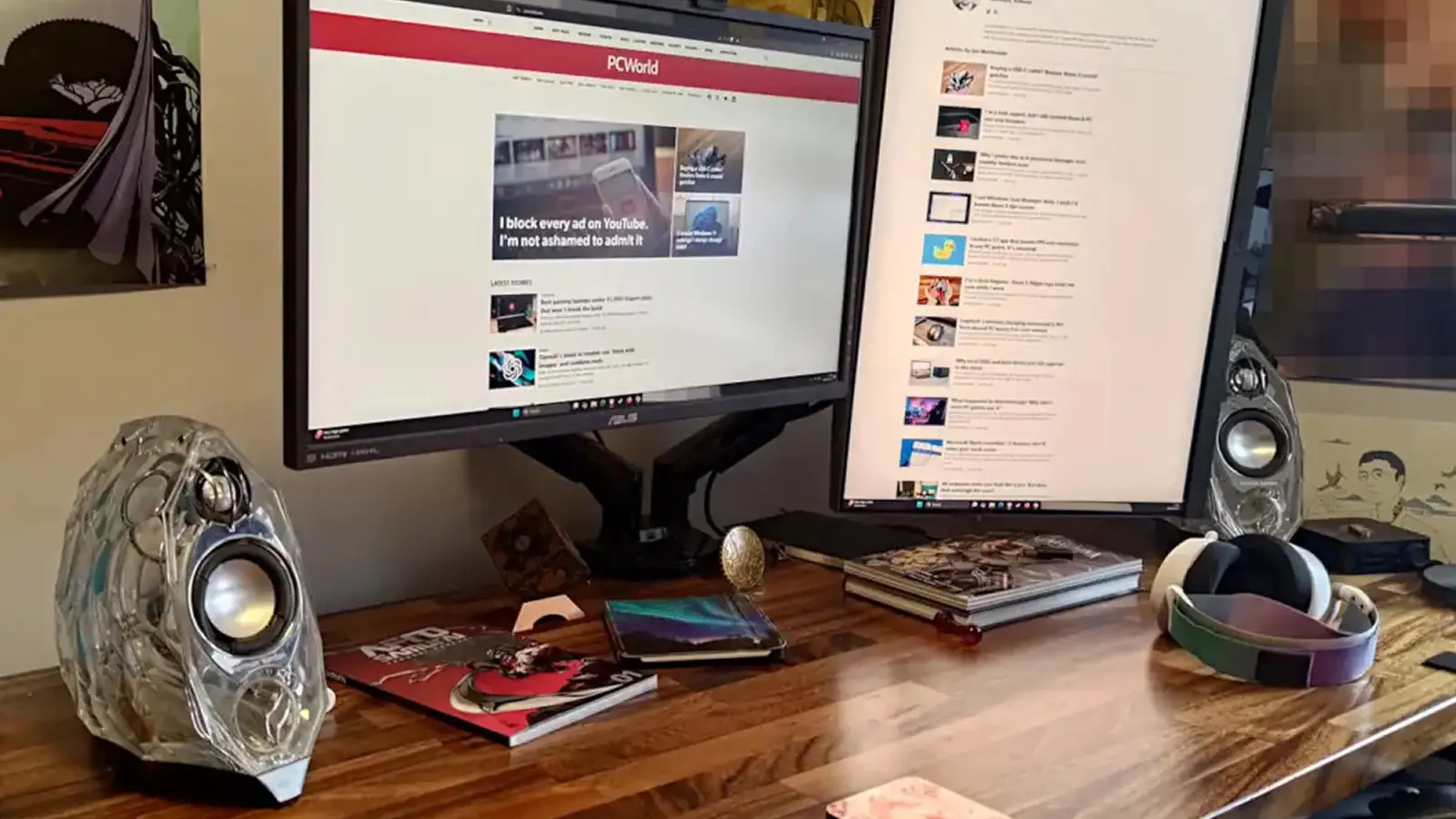 Harman Kardon GLA-55 speakers on a desktop.