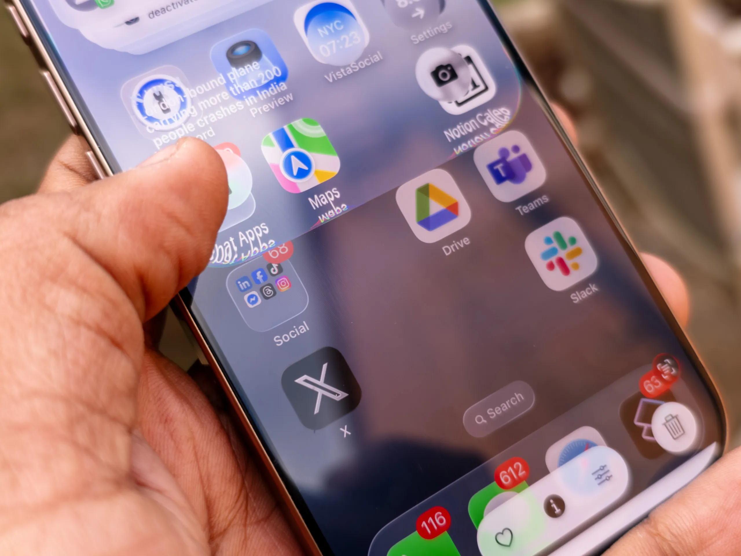 Scrolling down to reveal the notification center in Liquid Design on the iOS 26 developer beta 1 running on the iPhone 16 Pro