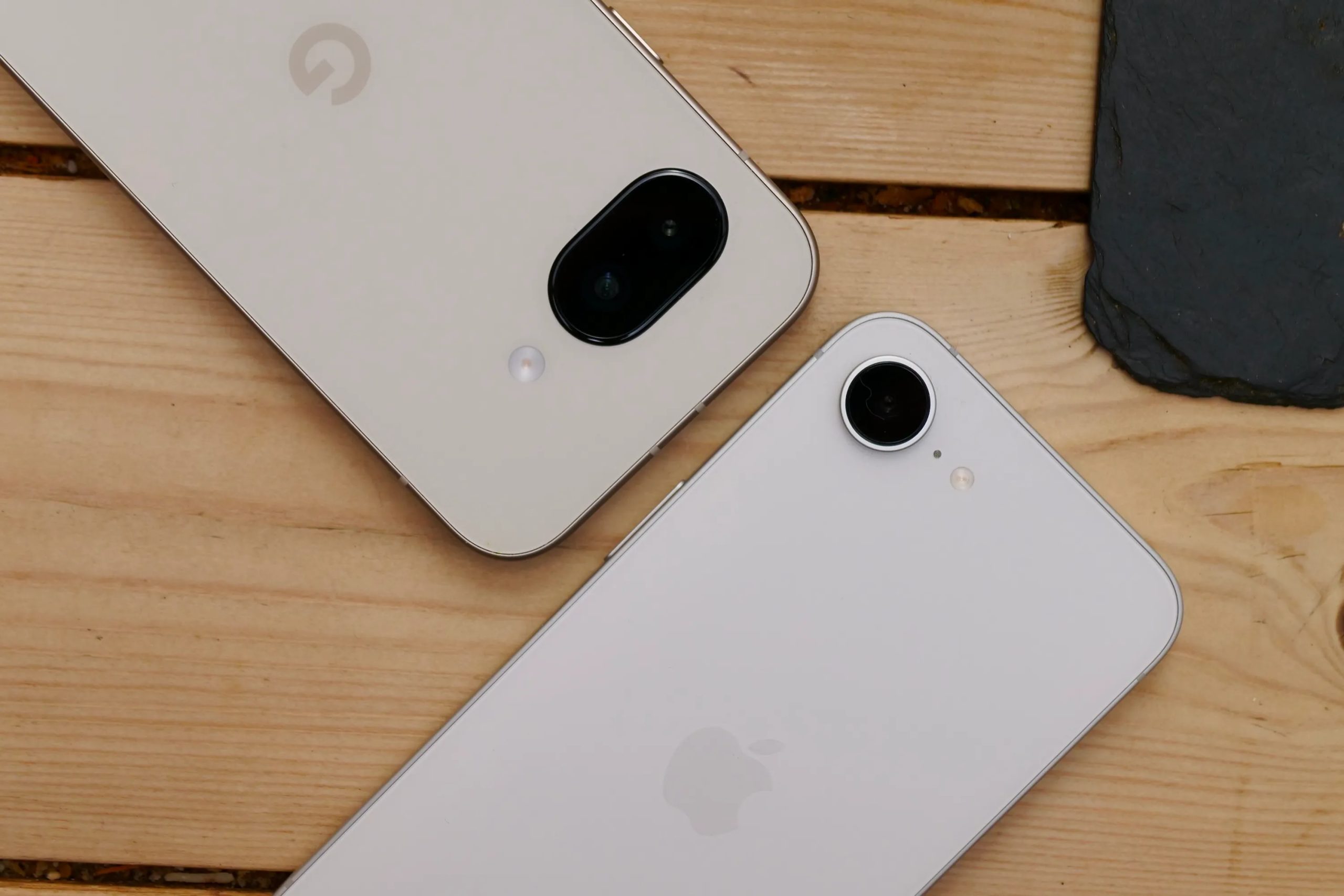 The Google Pixel 9a and Apple iPhone 16e's cameras.