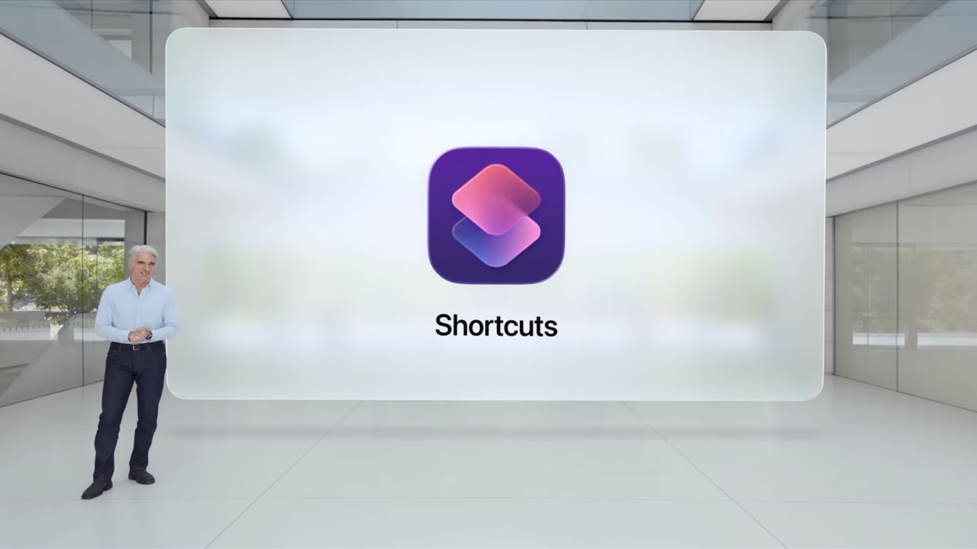 Craig Federighi stands in front of the Shortcuts app icon