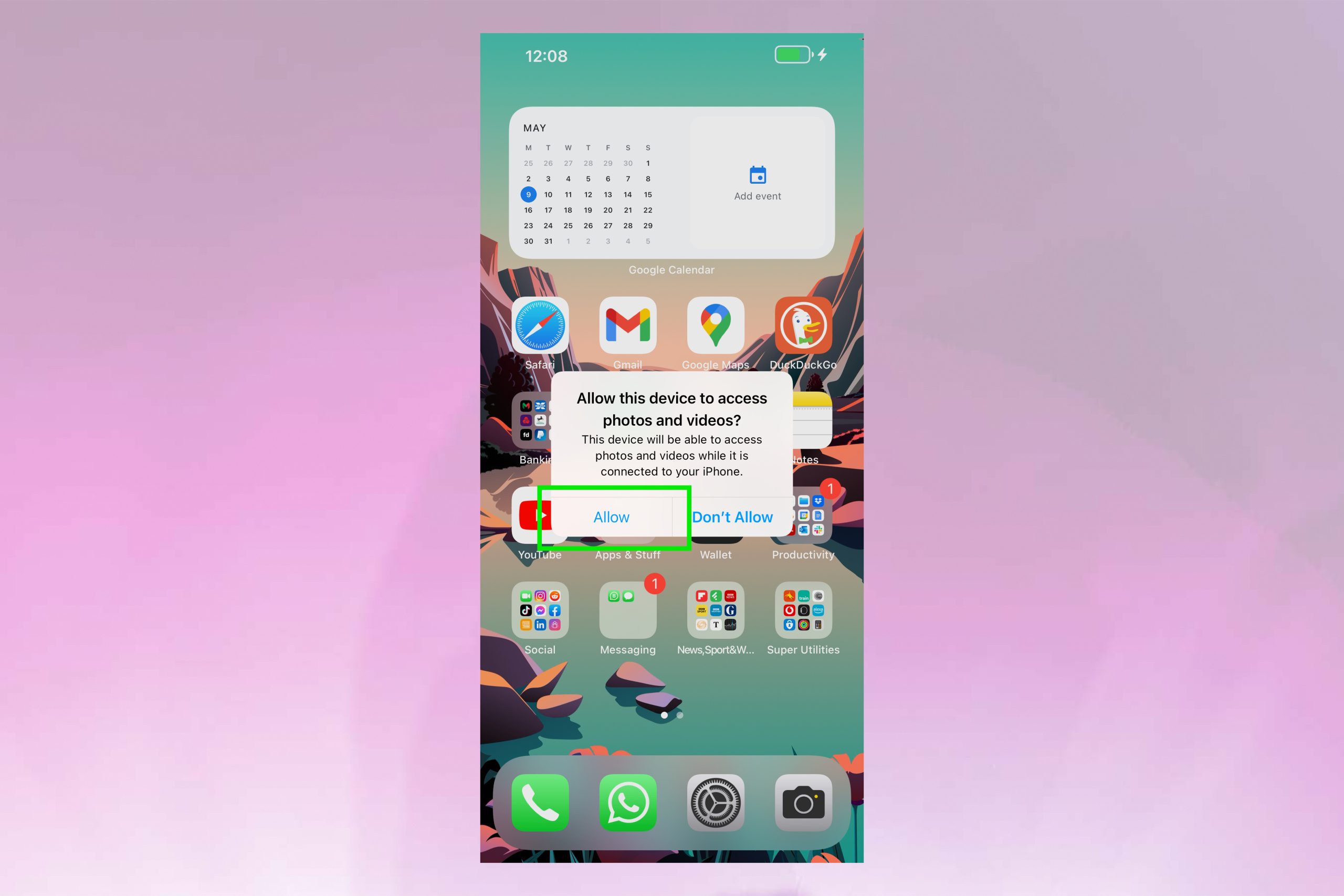 An iPhone displaying a prompt to allow a USB device access to photos and videos.