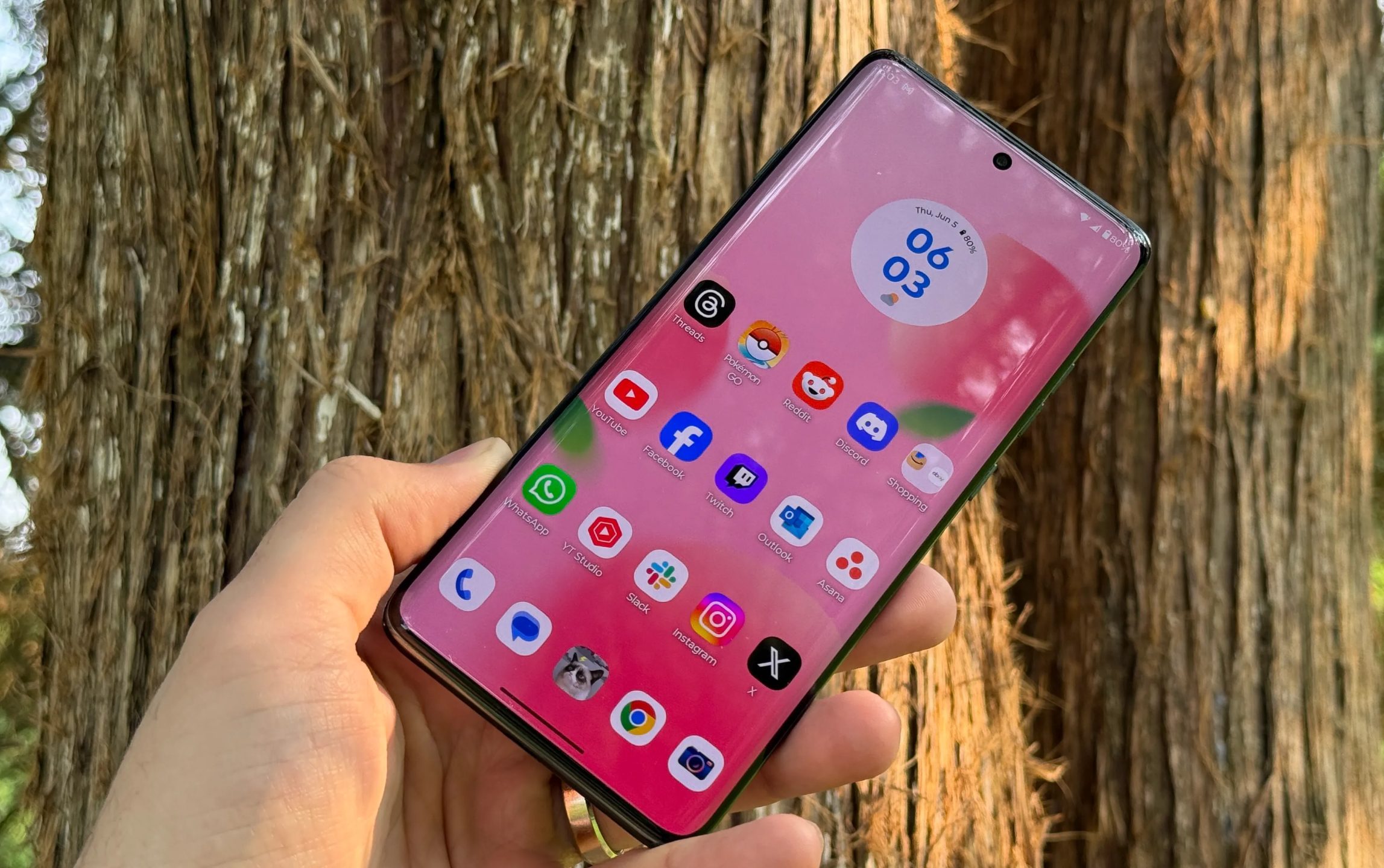 Motorola Edge 2025 display outdoors against a tree