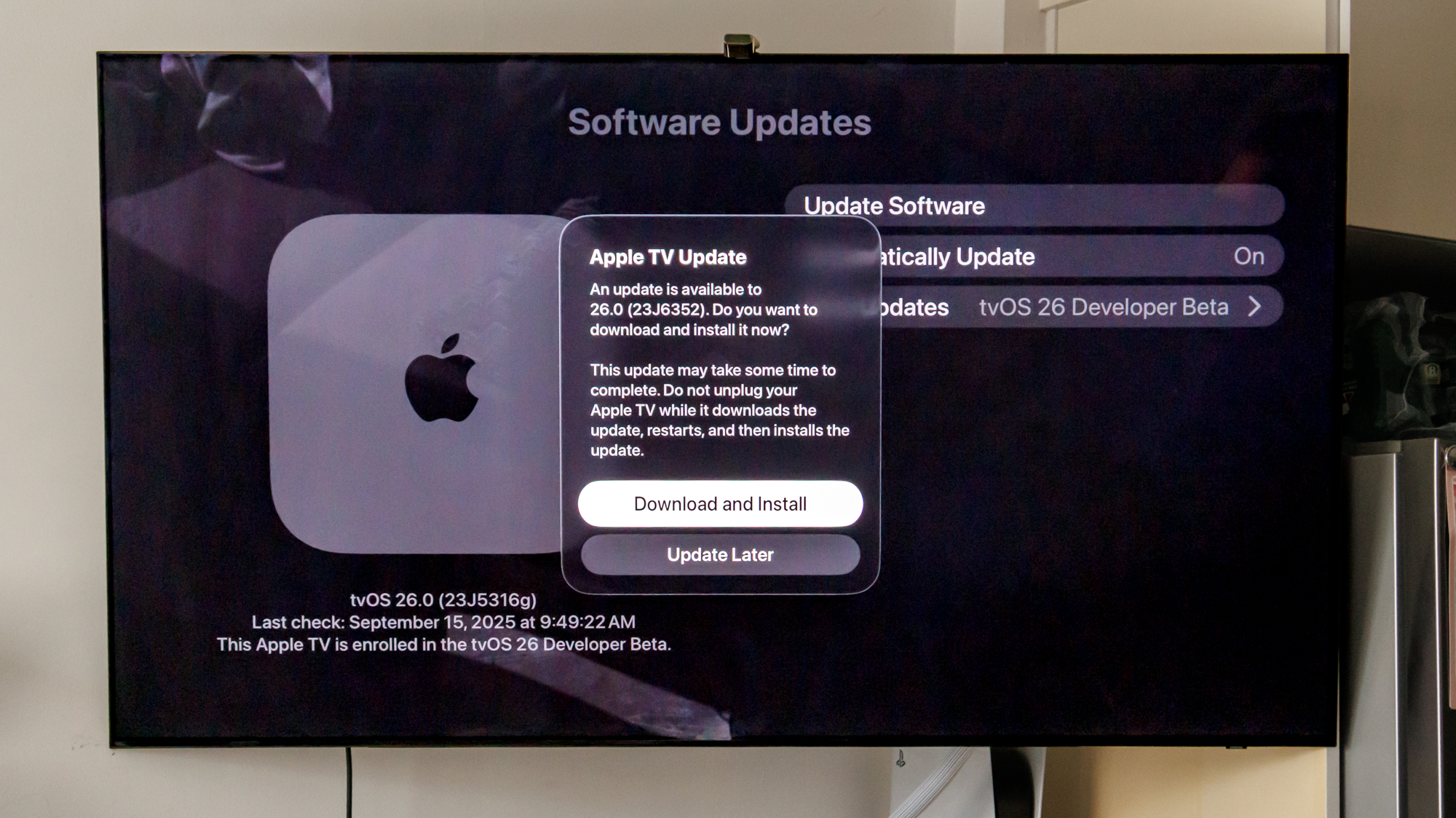 Apple tvOS 26 download screen