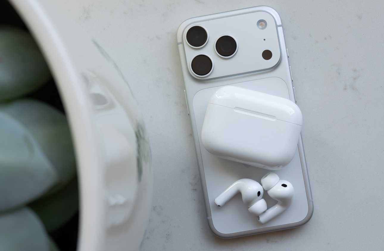 The AirPods Pro 3 sitting beside the iPhone 17 Pro 