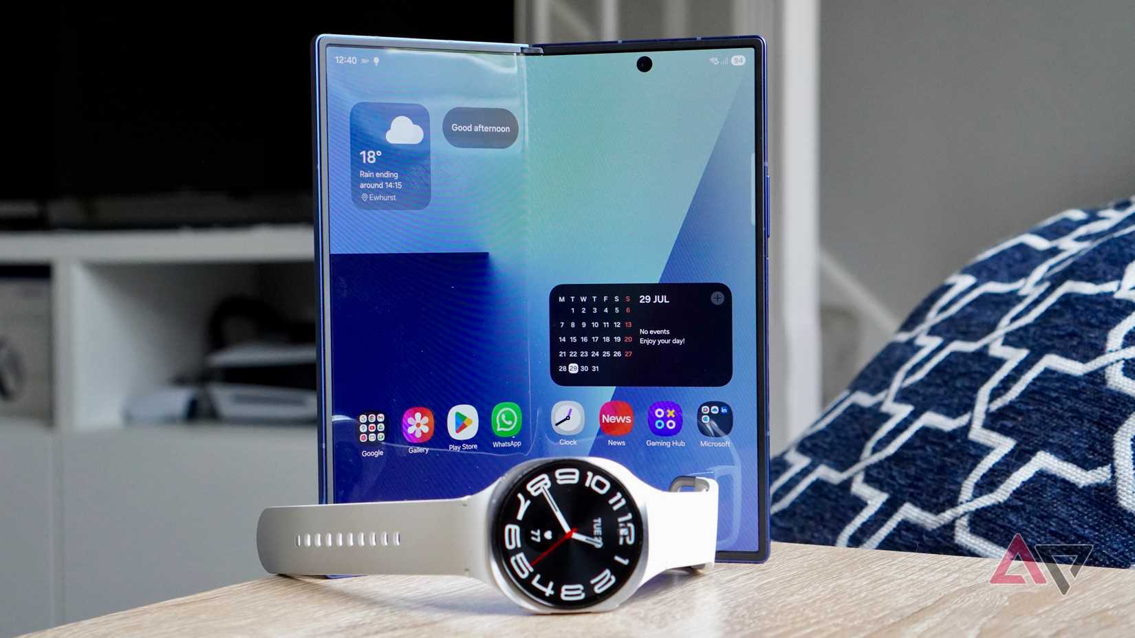 The Samsung Galaxy Watch 8 with the open Samsung Galaxy Z Fold 7