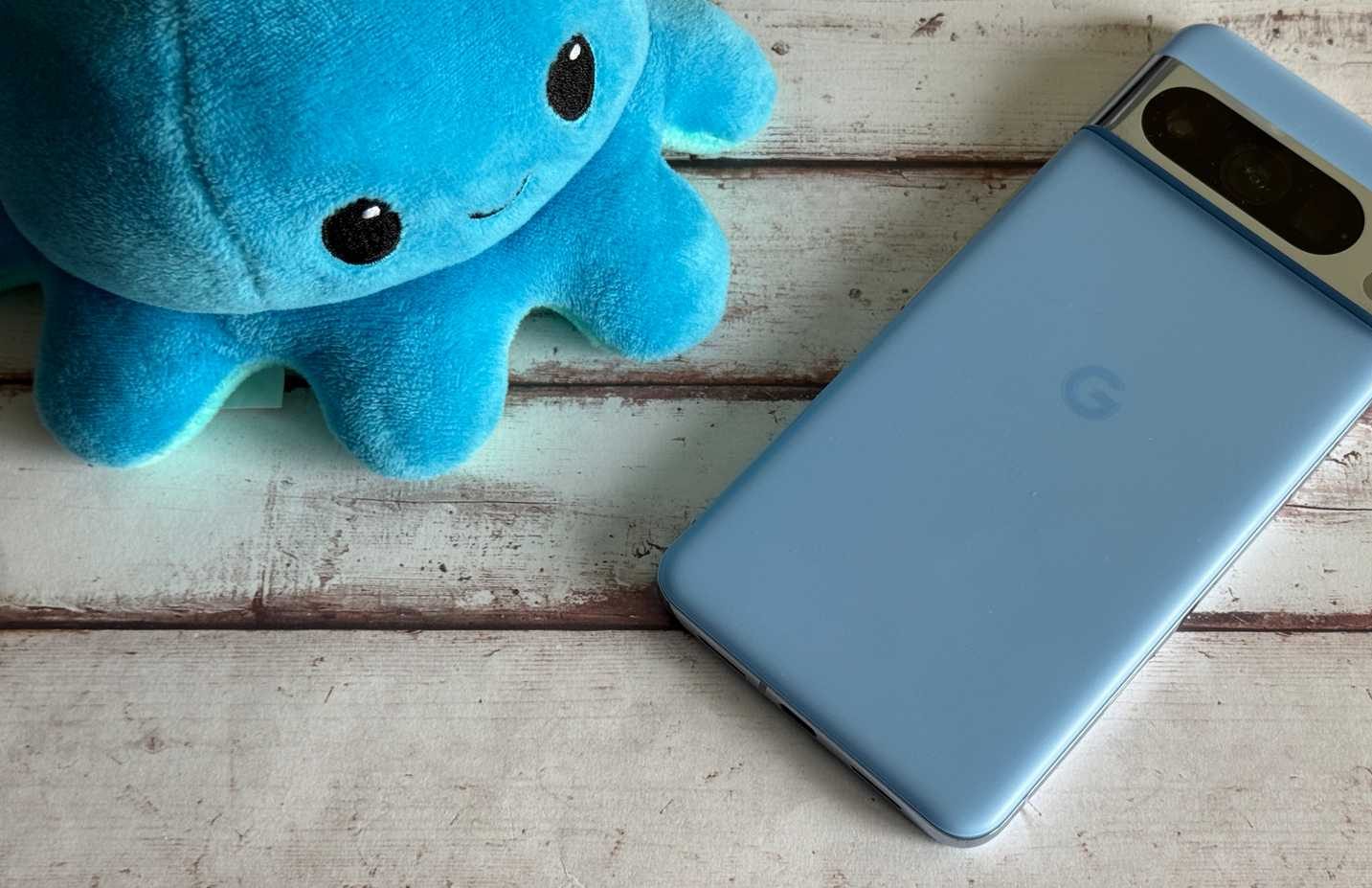 Google Pixel 8 Pro sitting next to a plush