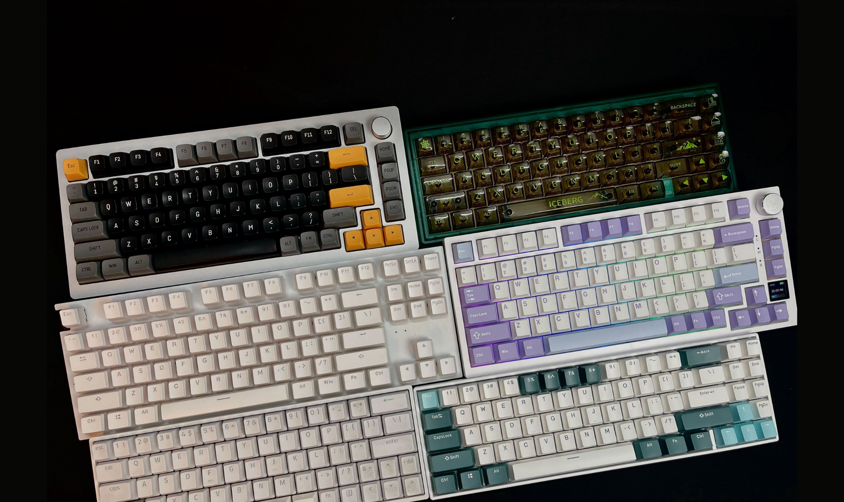 صورة تعرض 6 لوحات مفاتيح ميكانيكية تتضمن Monsgeek m1 بأغطية مفاتيح سوداء وصفراء، و Ciy gas67 بأغطية مفاتيح شفافة، ولوحة مفاتيح NZXT Function TKL، و Ajazz AK 820 Pro بأغطية مفاتيح أرجوانية زرقاء وبيضاء، و Skyloong SK68 و RK 71 بنظام ألوان أخضر معسكر.