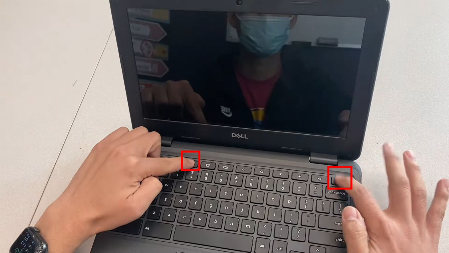 اضغط مع الاستمرار على كلا الزرين