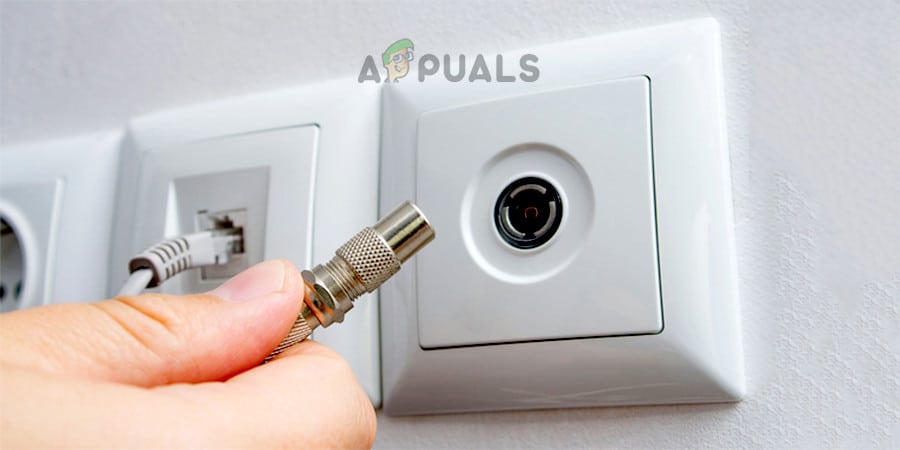 أدخل كابل الكواكسيال في منفذ شبكة آخر