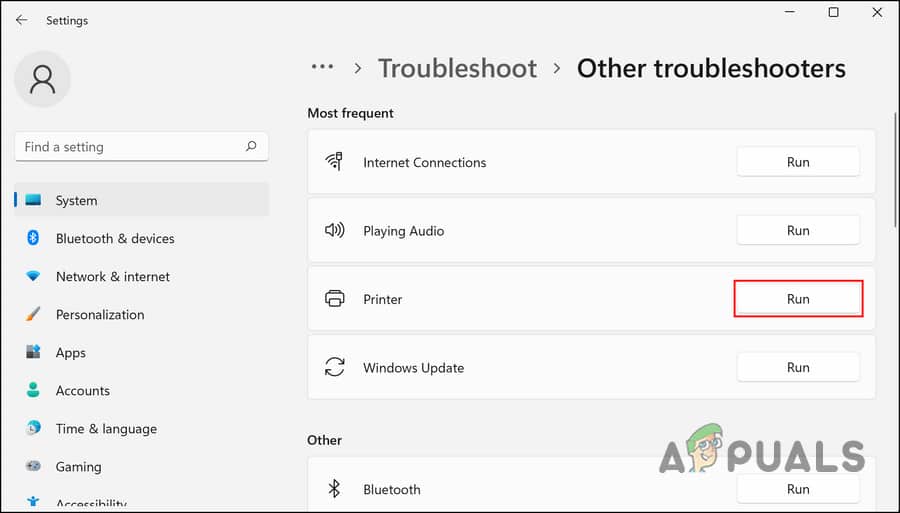 تشغيل مستكشف أخطاء الطابعة