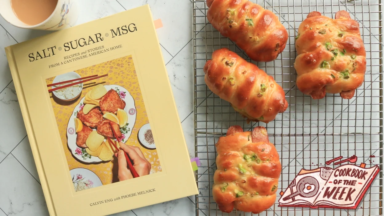 Salt Sugar MSG cookbook next to hot dog buns and tea.