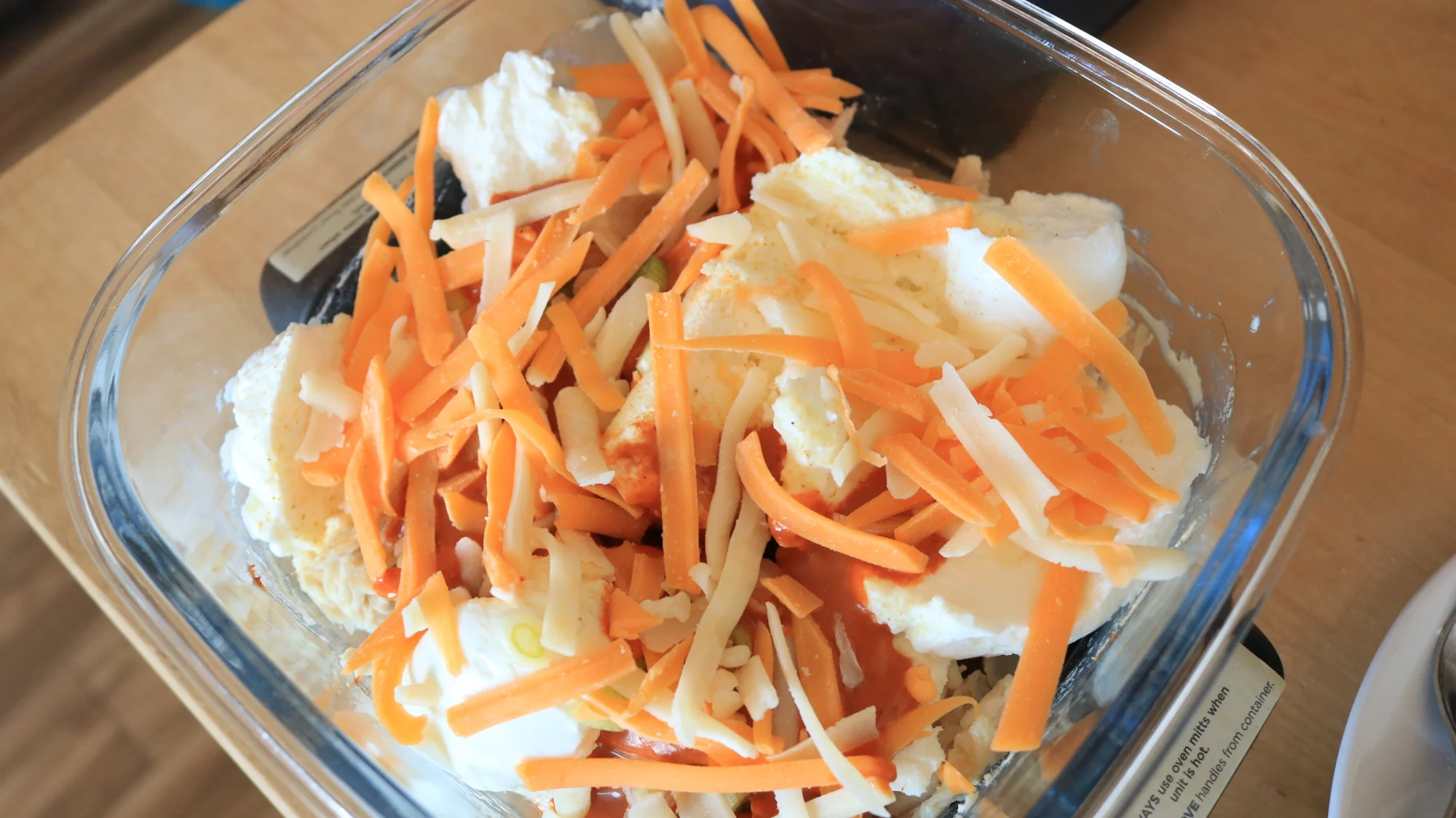 Cheese, yogurt, hot sauce, and chicken in the Ninja Crispi.