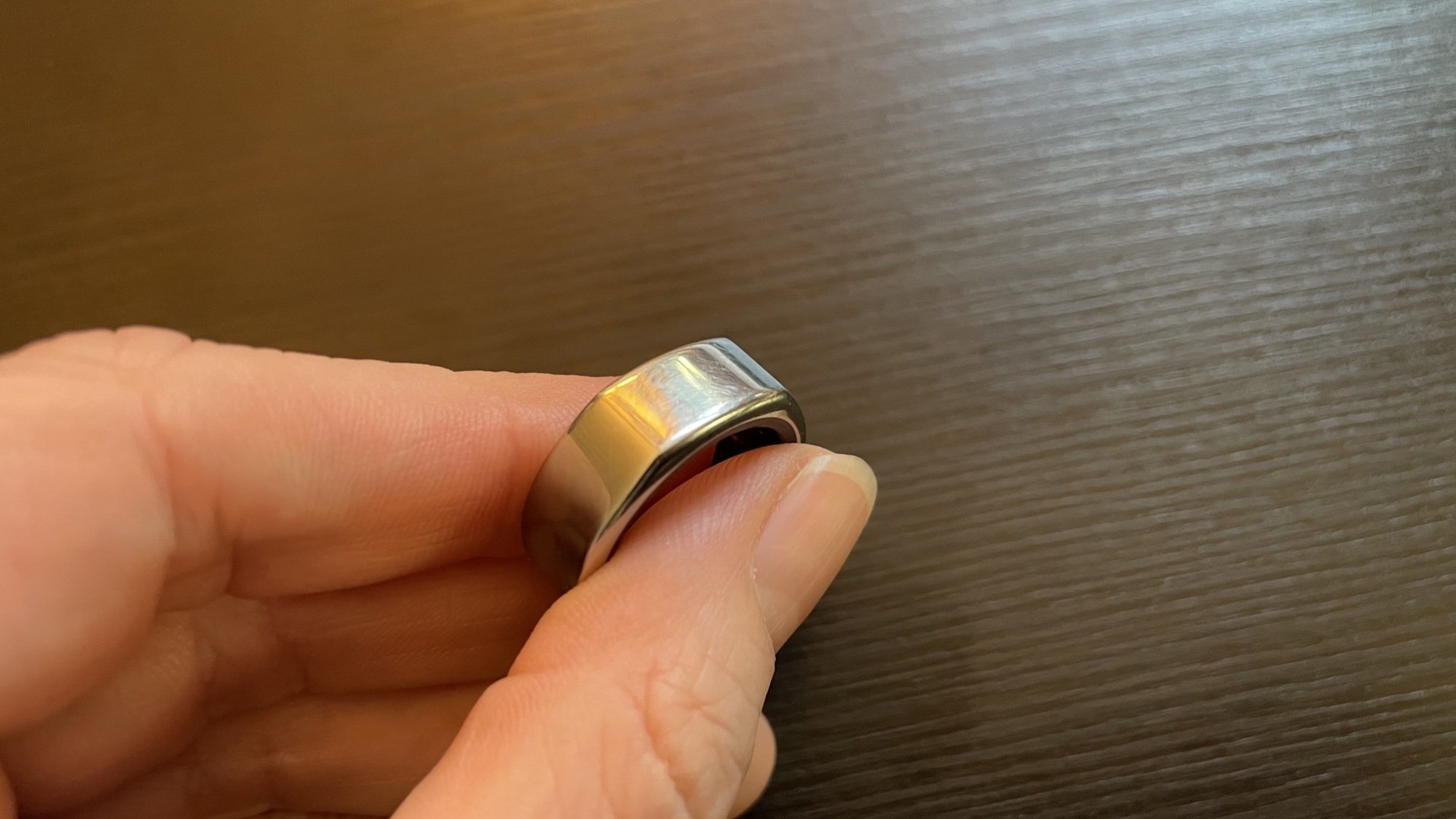 Ring held in hand. Subtle, minor scuffs on top.