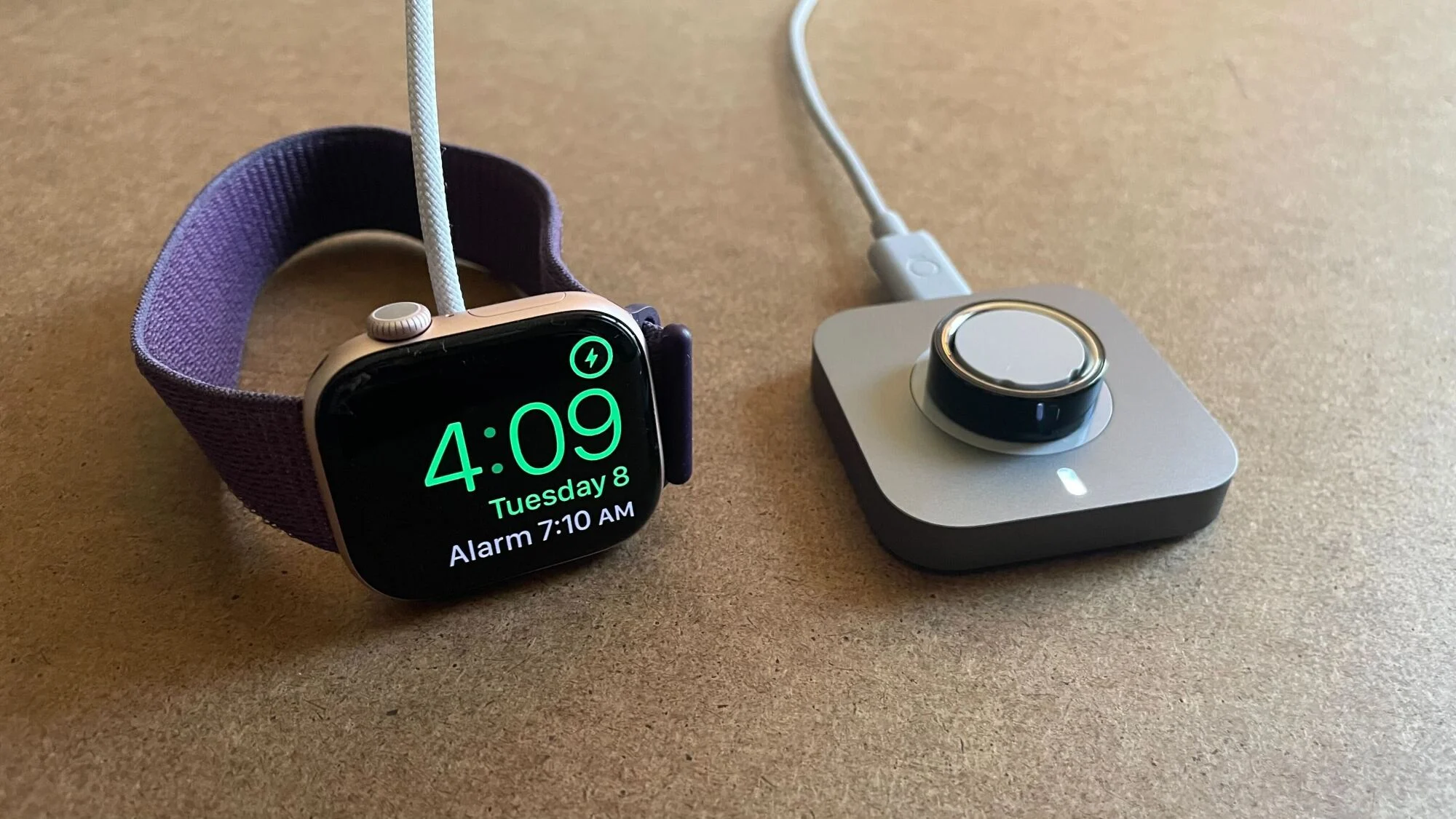 Apple Watch and Oura ring, both on their chargers