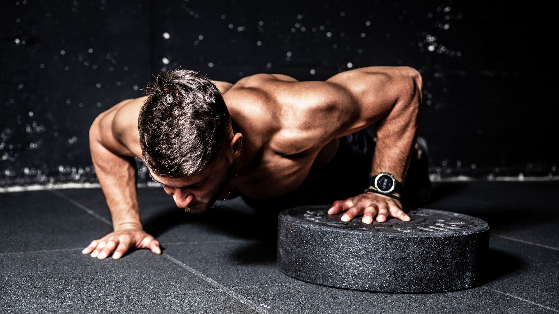 a photo of a man doing a push up 