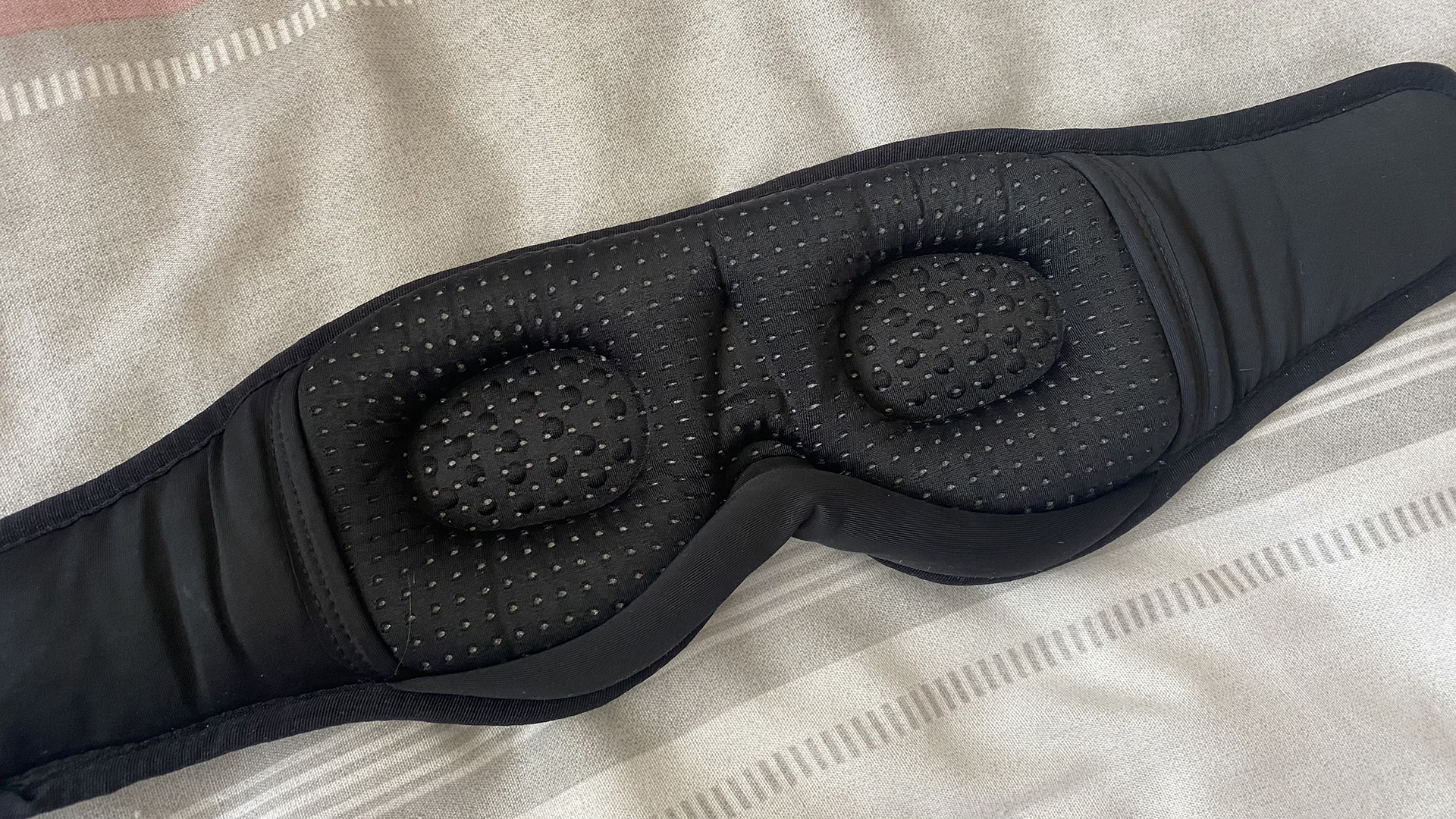 A closeup of the reverse of the MUSICOZY headphone sleep mask, with 3D contoured eye shape to improve blackout and reduce pressure
